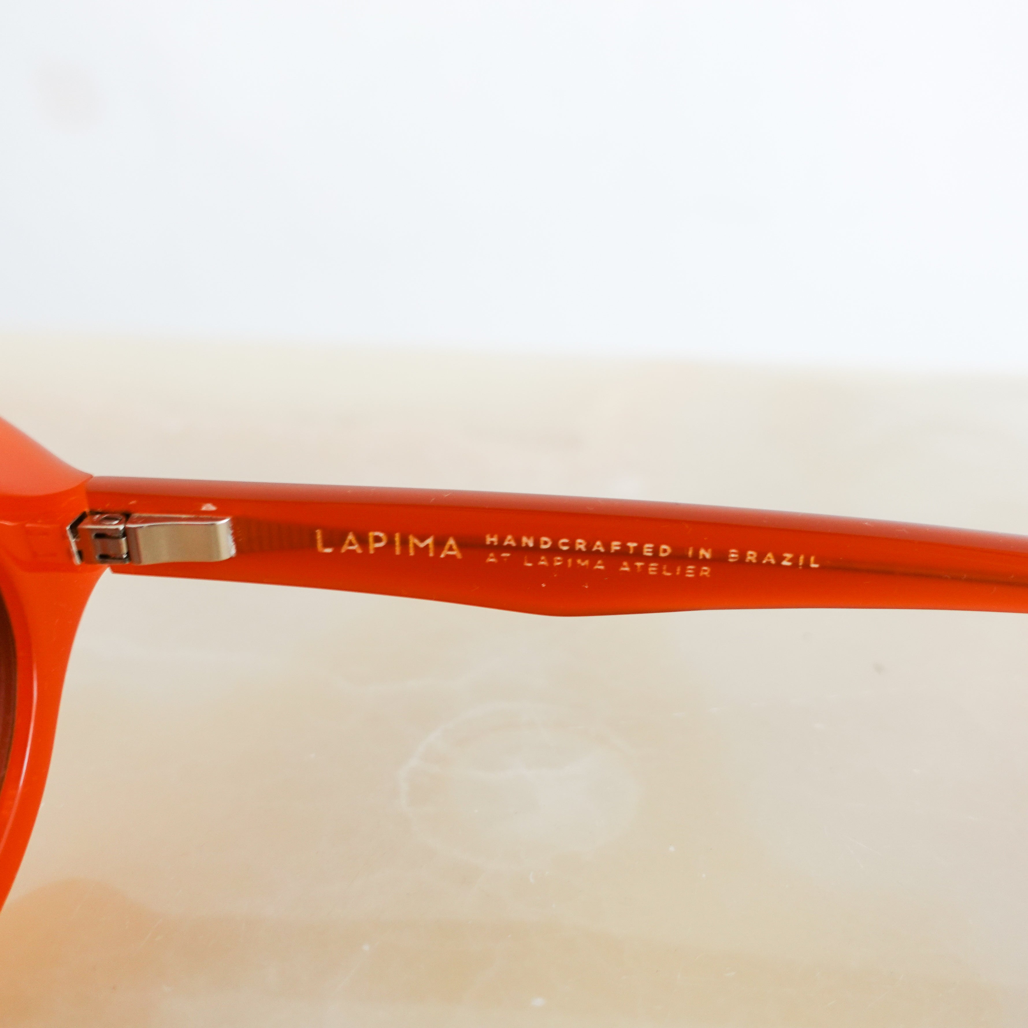 Orange oval sunglasses RRP £395