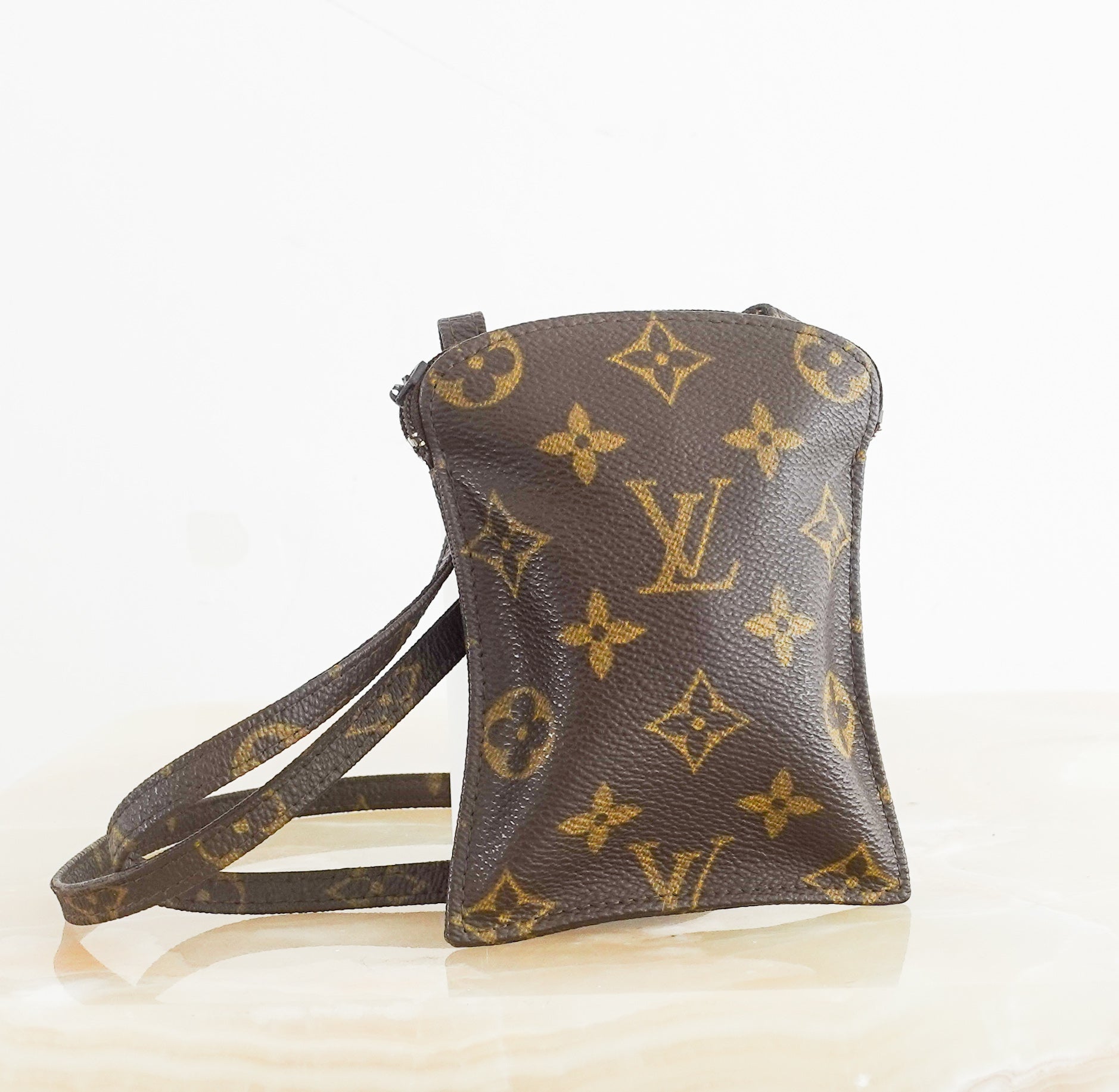 Monogram secret pouch bag