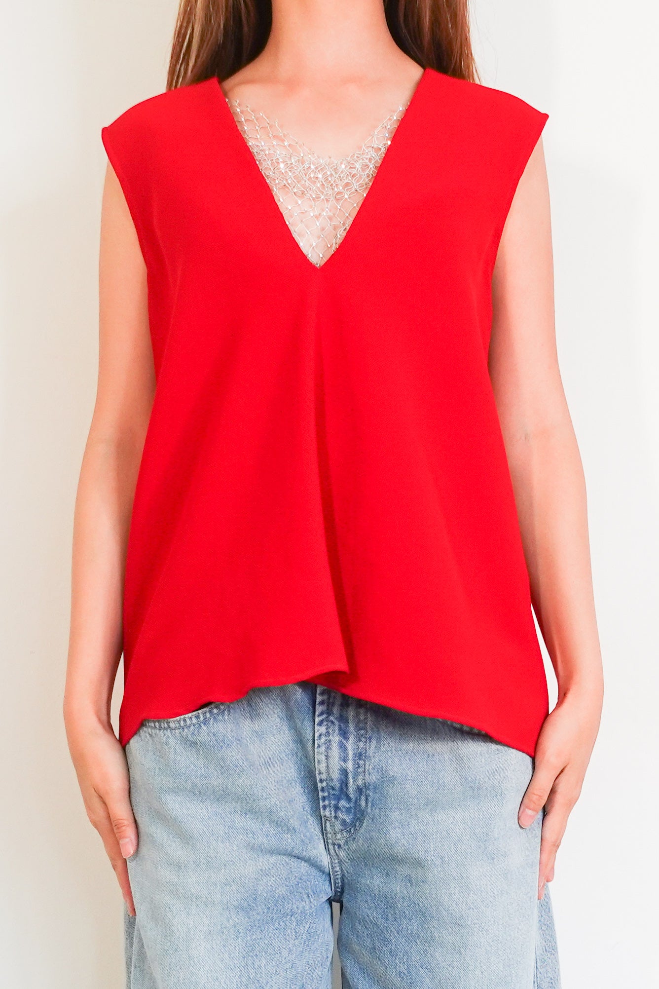 Red sleeveless top with crystal mesh appliqué