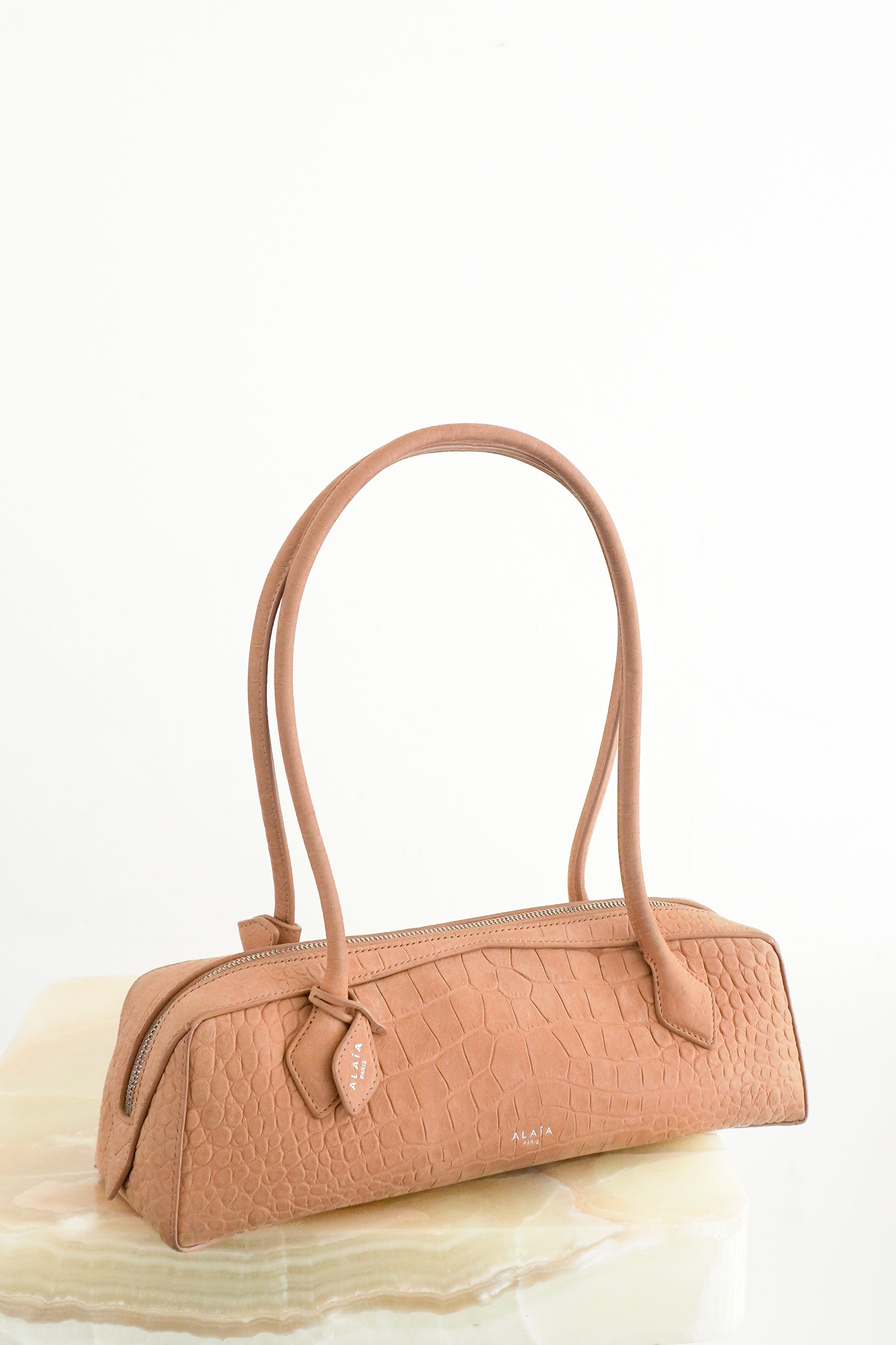 Alaïa Le Teckel Medium Croc-Embossed Suede Shoulder Bag Beige front photo chelsea london