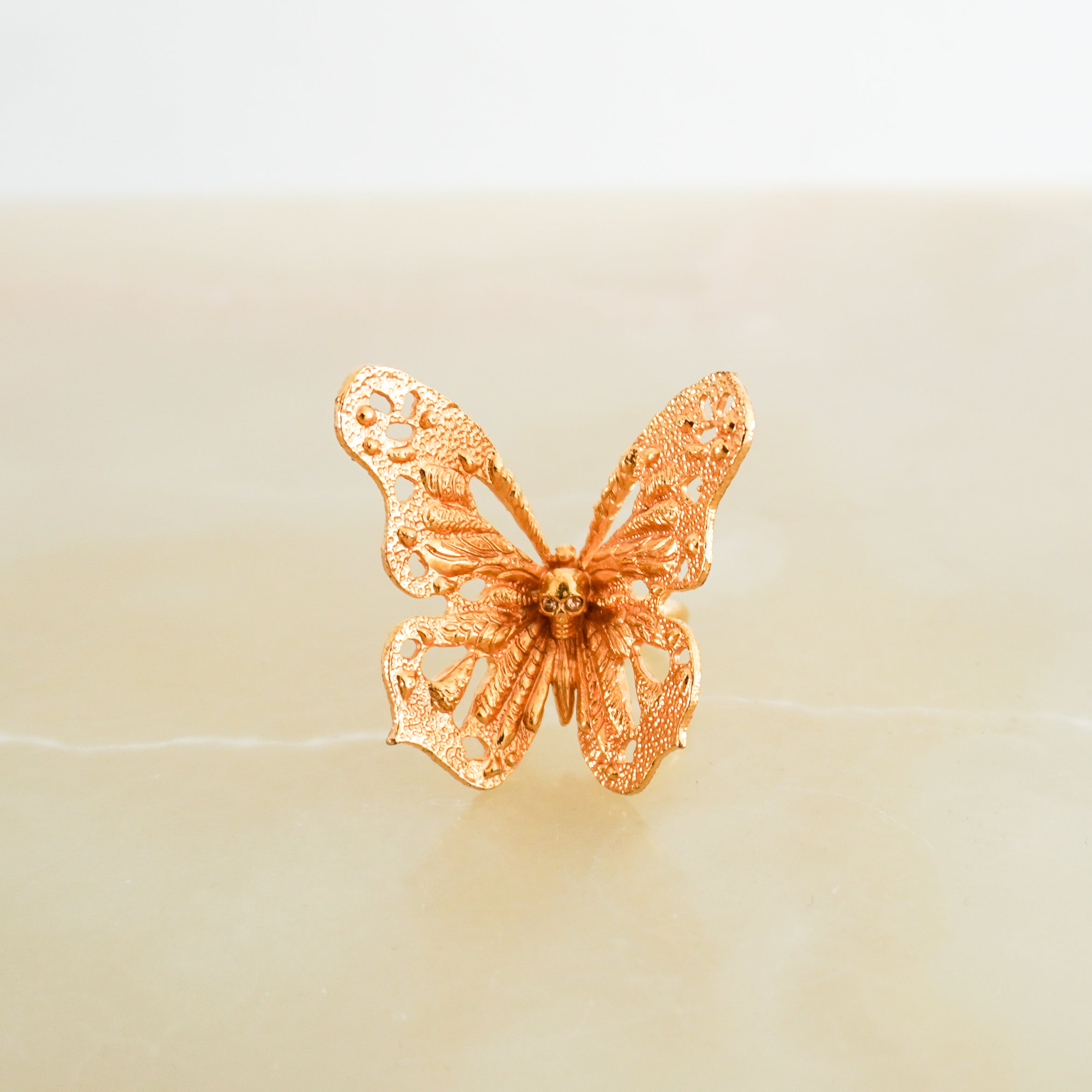 Alexander McQueen Gold-Tone Butterfly Skull Ring front photo chelsea london close