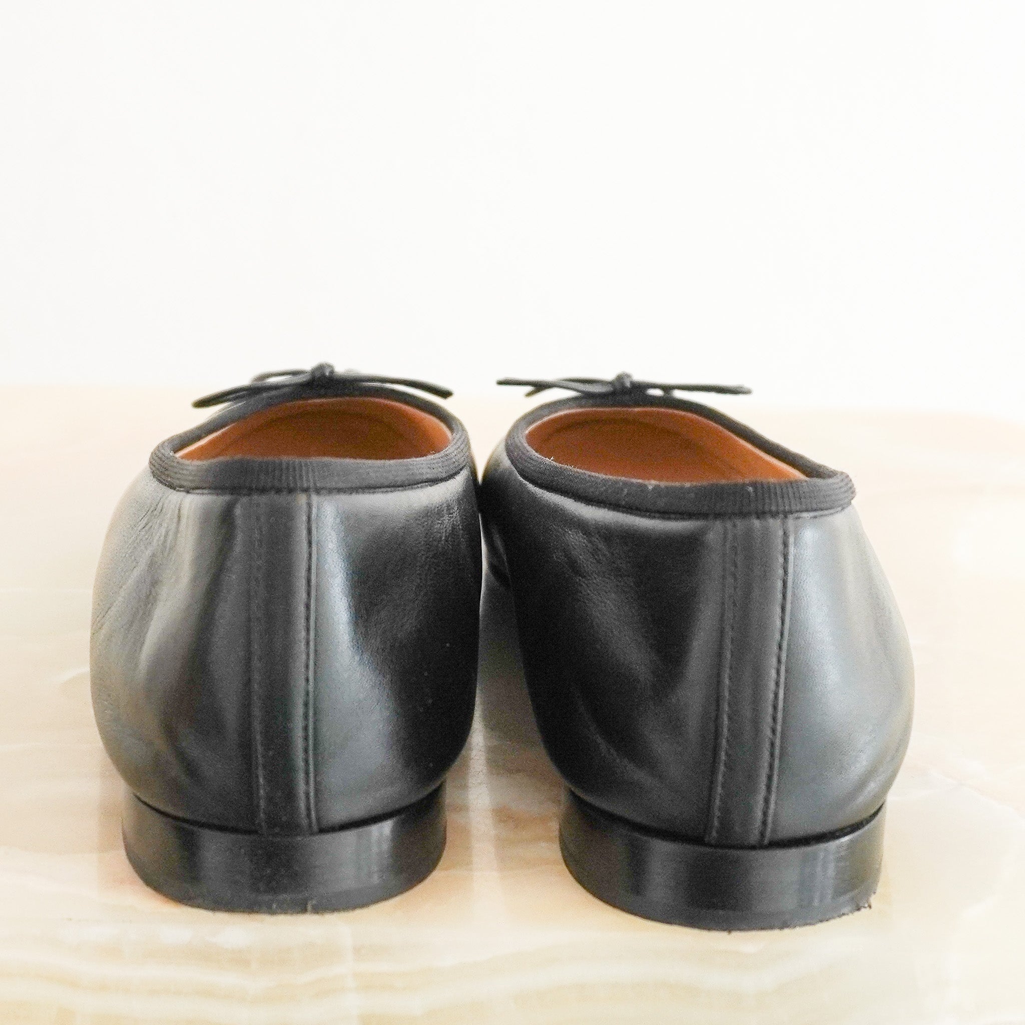 Back image of the CHANEL Black Cap-Toe Ballet Flats