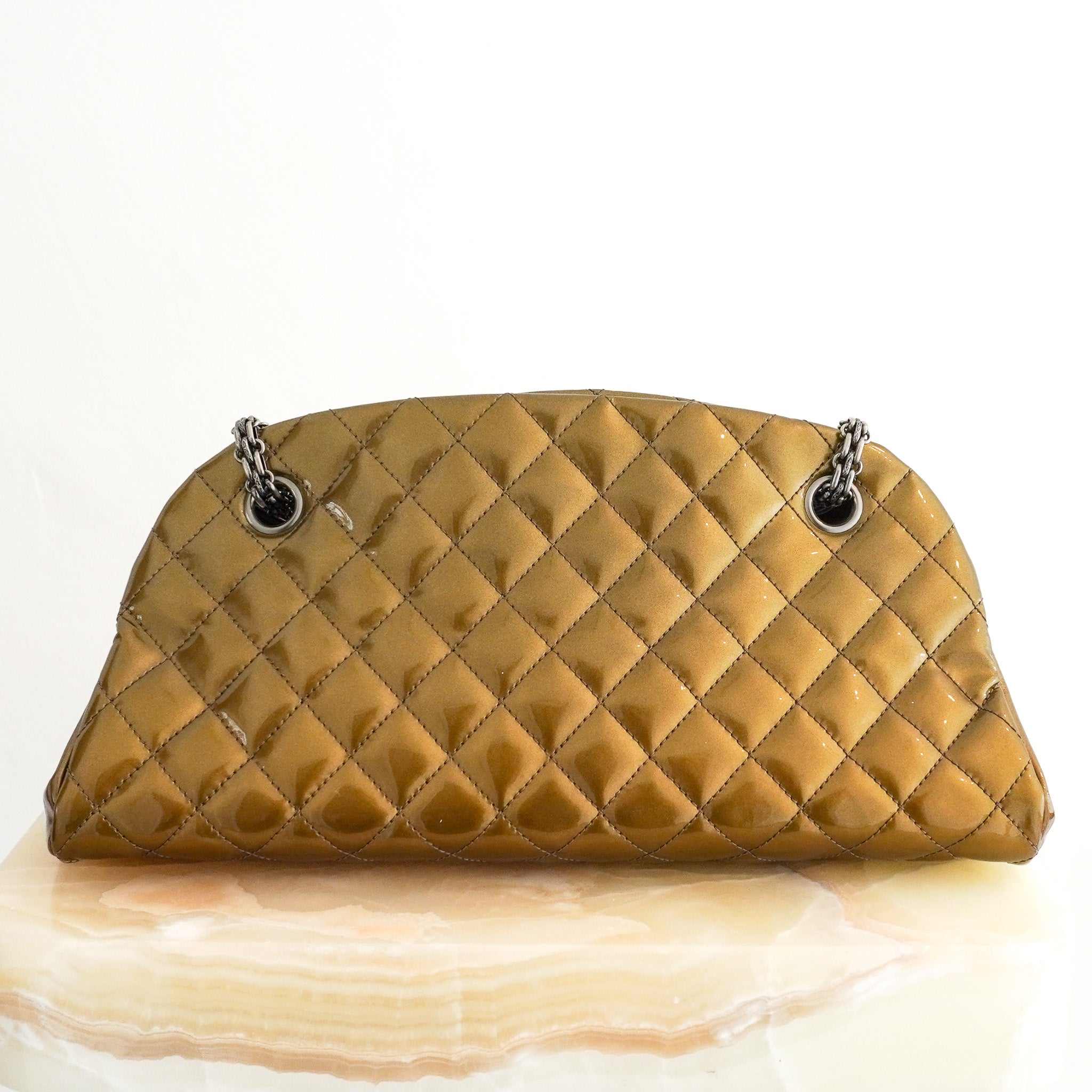 Back image of the Chanel Just Mademoiselle Patent Quilted Bag in Metallic Olive Green