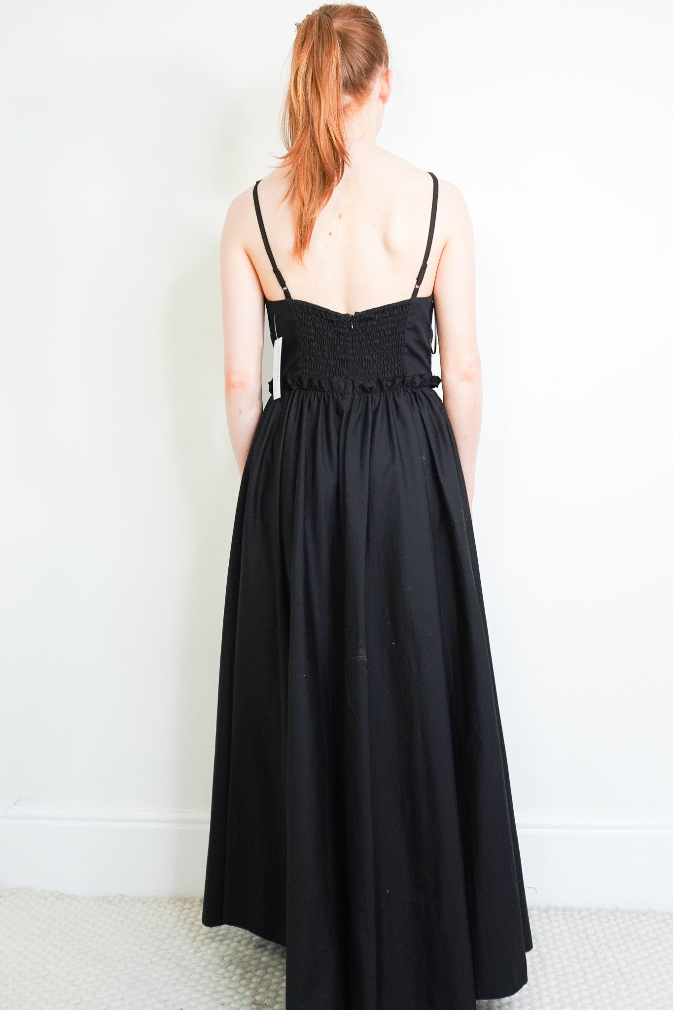 Back image of the Goop. Black Dress 