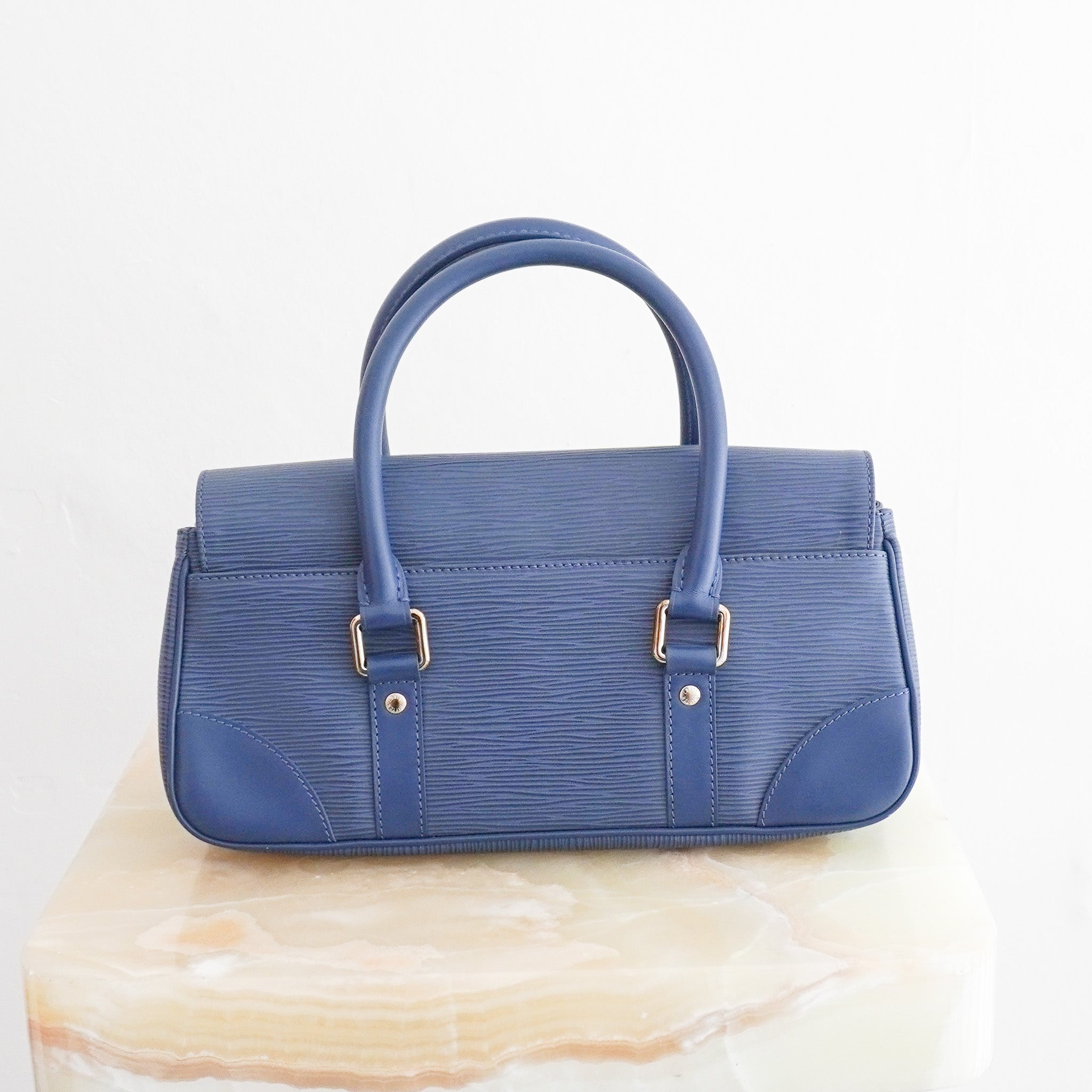 Back image of the Louis Vuitton Ségur PM Toledo Blue Epi Leather Handbag