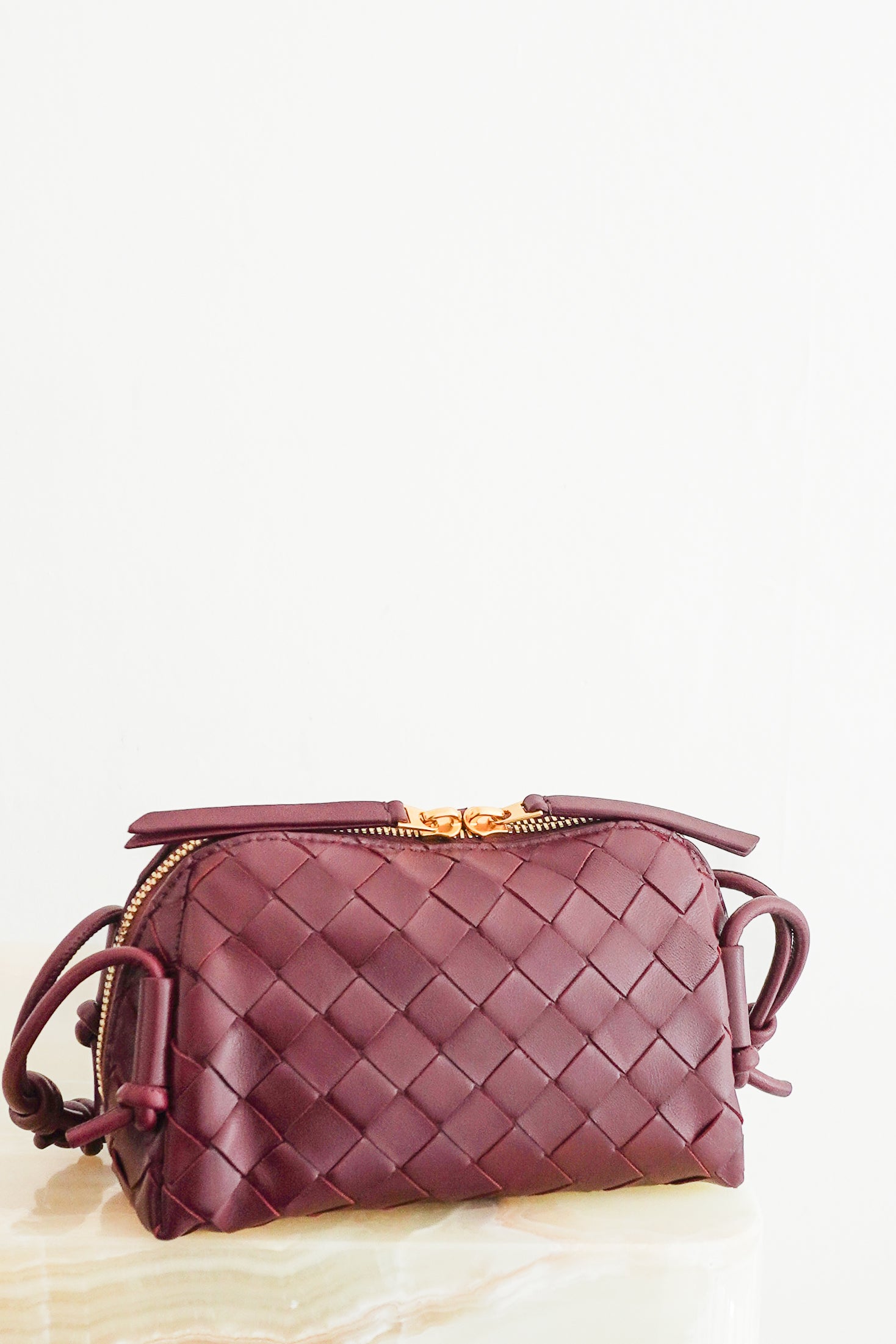 Bottega Veneta Intrecciato Concert Crossbody Bag Burgundy Leather front photo chelsea london