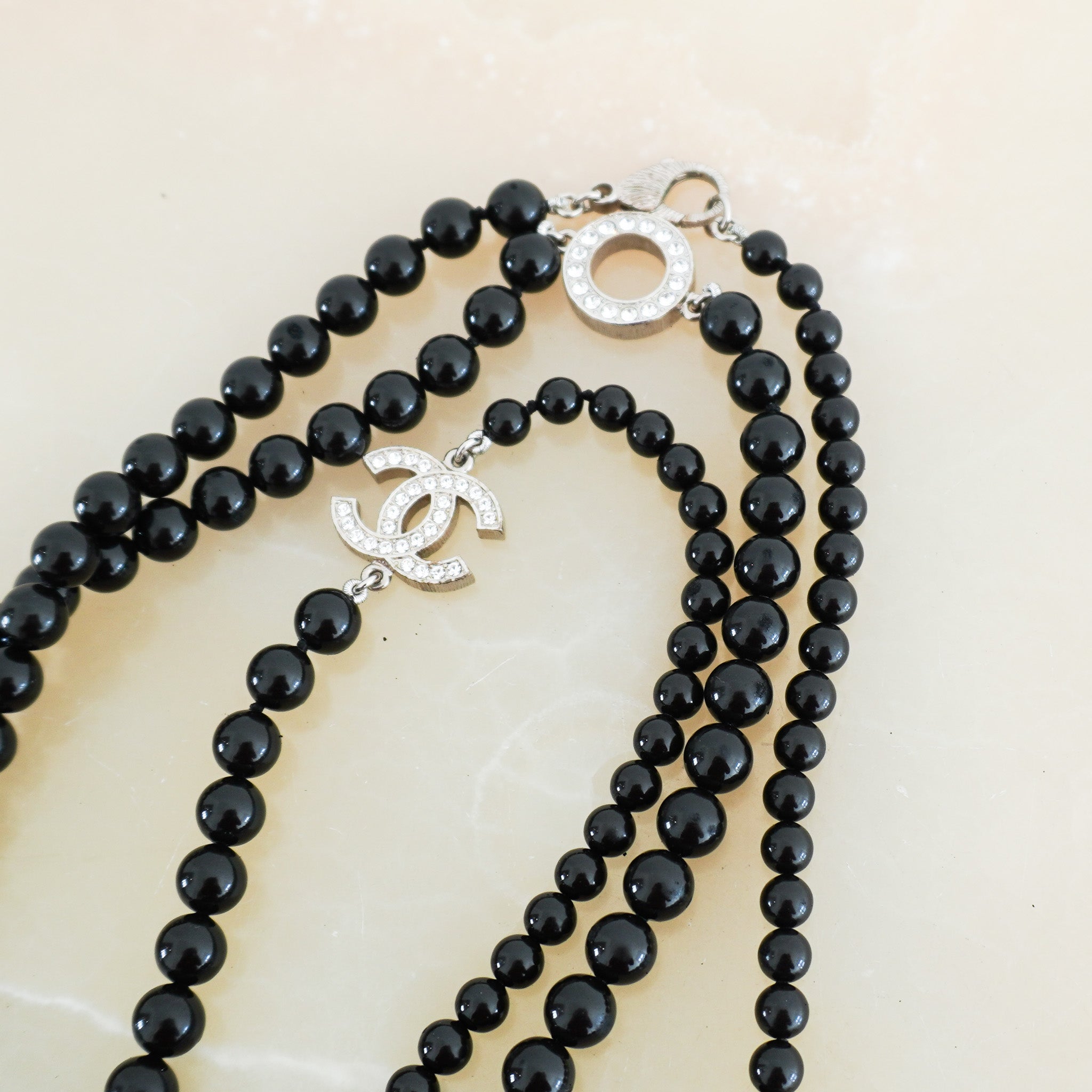 Chanel-Long-Black-Necklace-with-Applique-side-picture