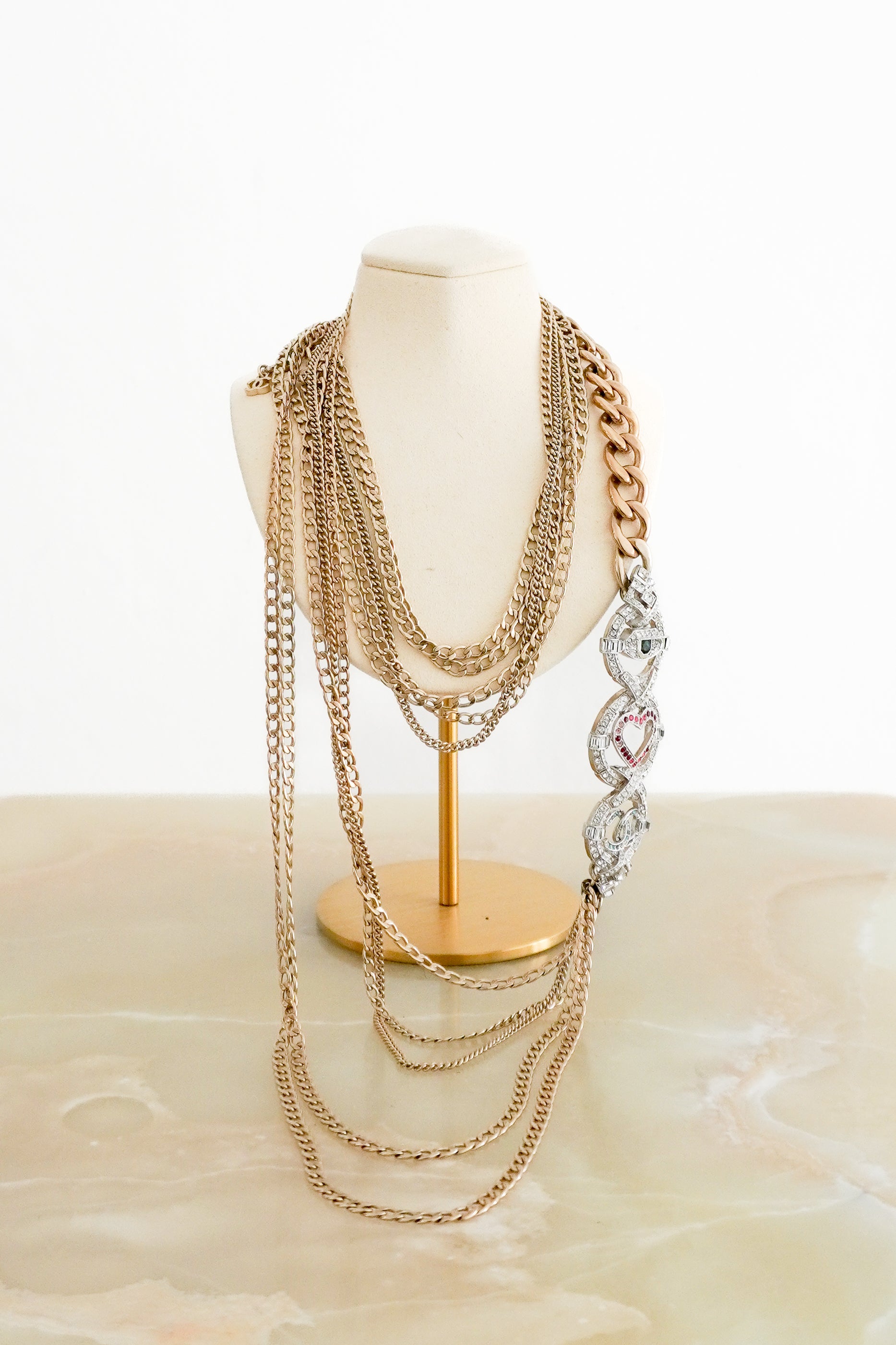 Chanel A16K Crystal Heart Eye CC Multi Charm Necklace Gold Tone Metal front photo chelsea london