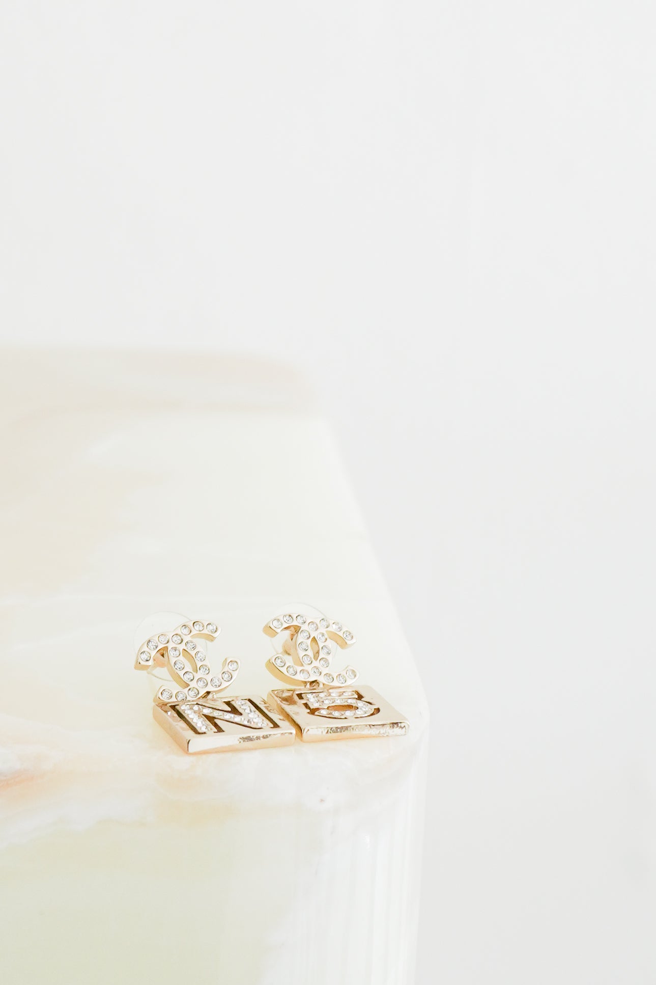 Chanel_A21_Gold-Tone_Crystal_CC_No.5_Mismatched_Drop_Earrings_front_photo_3