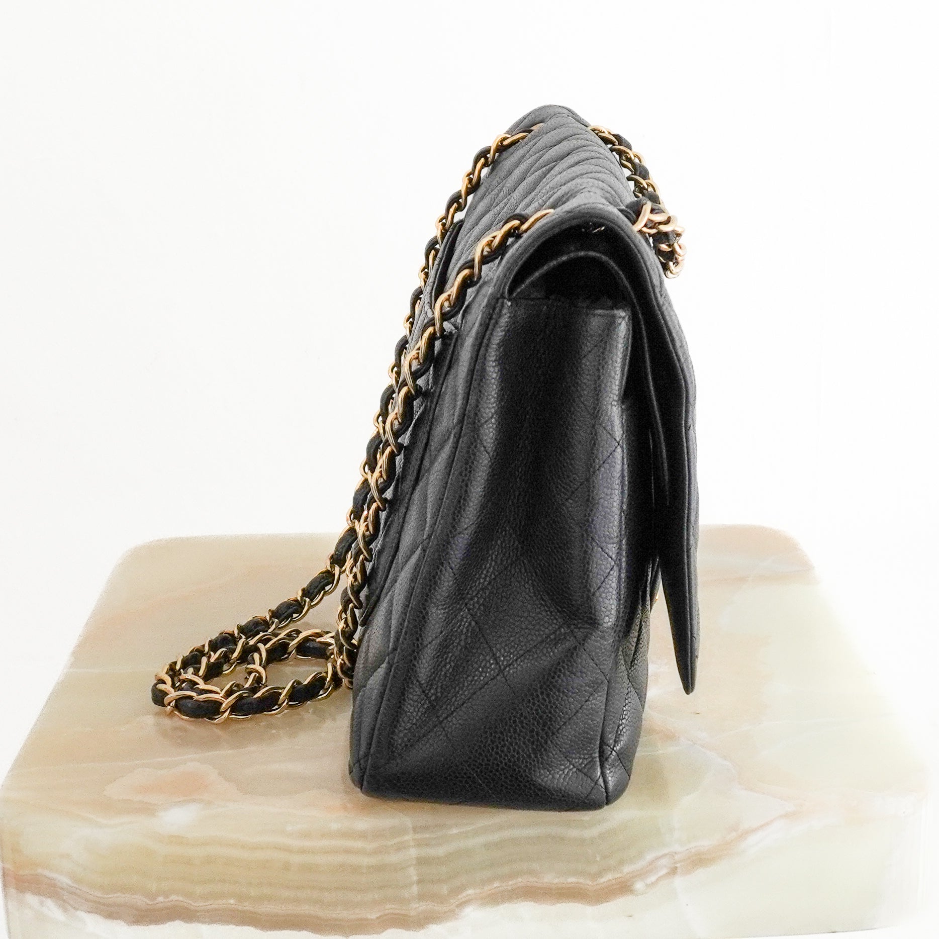 Chanel Jumbo Classic Double Flap Bag in Black Caviar Leather side photo chelsea london