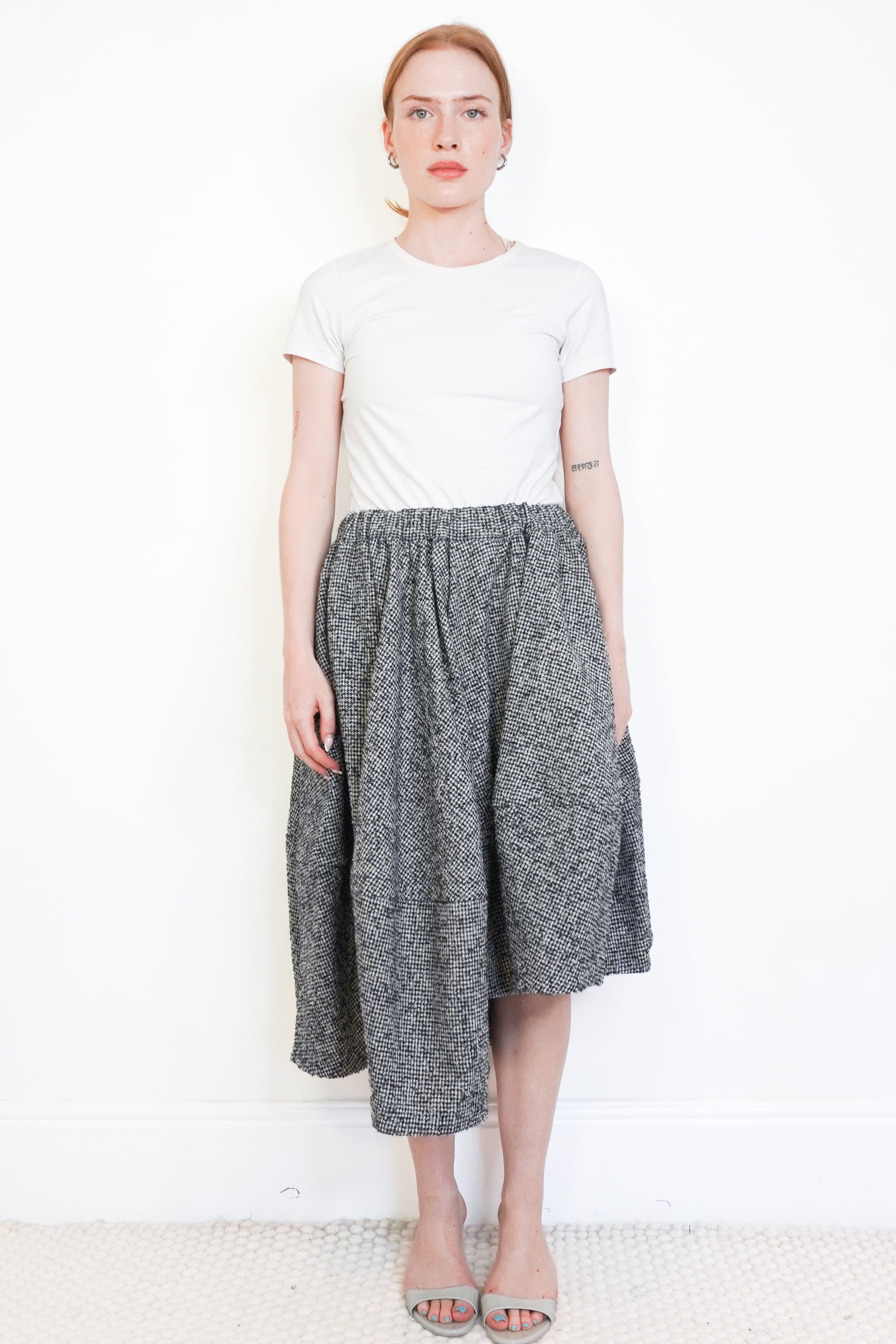 Commes de Garçons Black &amp; Ecru Pinwheel Houndstooth Asymmetric Wool Skirt front photo chelsea london