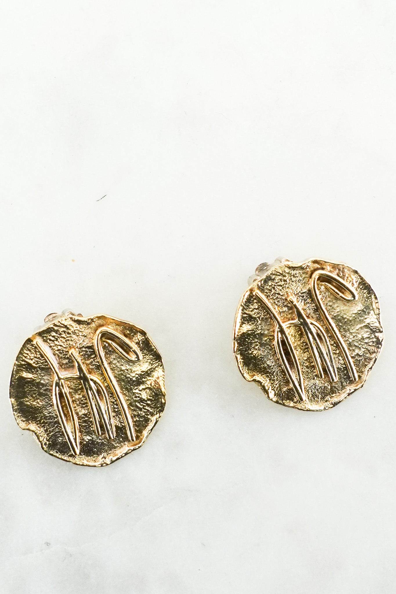 X Ian Young gold toned clip on earrings