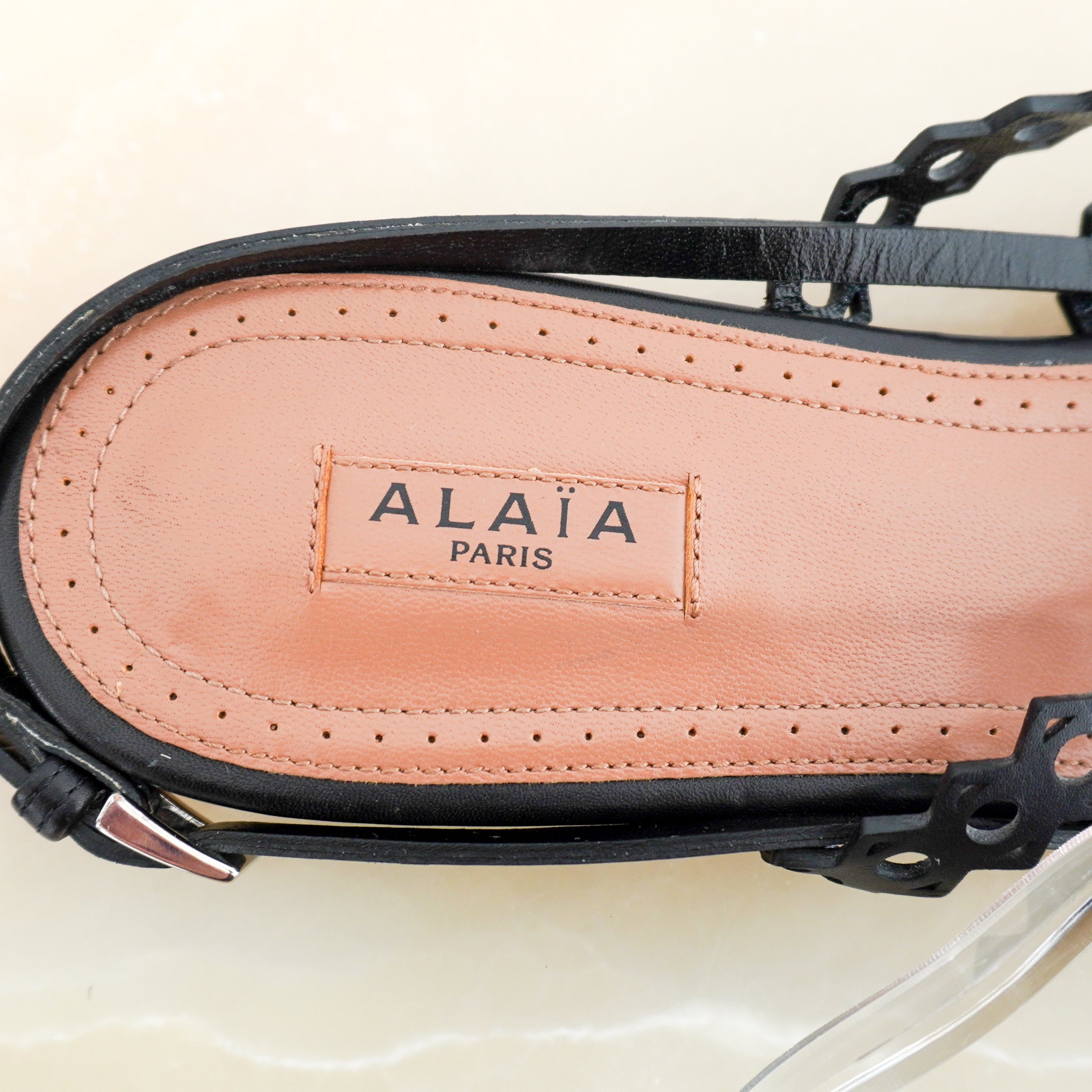 ALAÏA Laser-Cut Leather Flat Sandals in Black (RRP £690) | Authentic Preloved