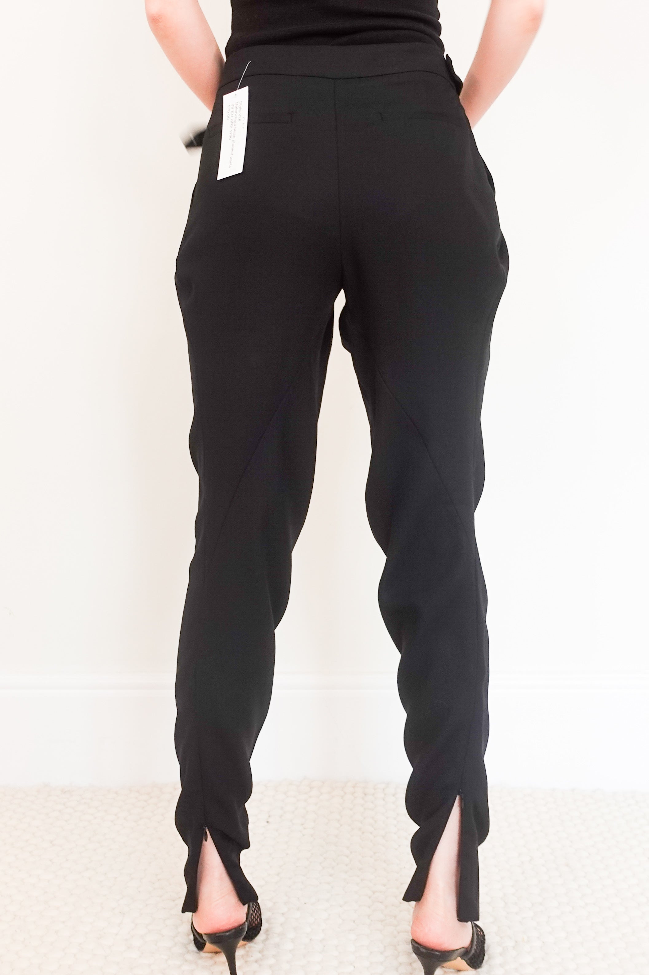 Black pleated pants RRP £190