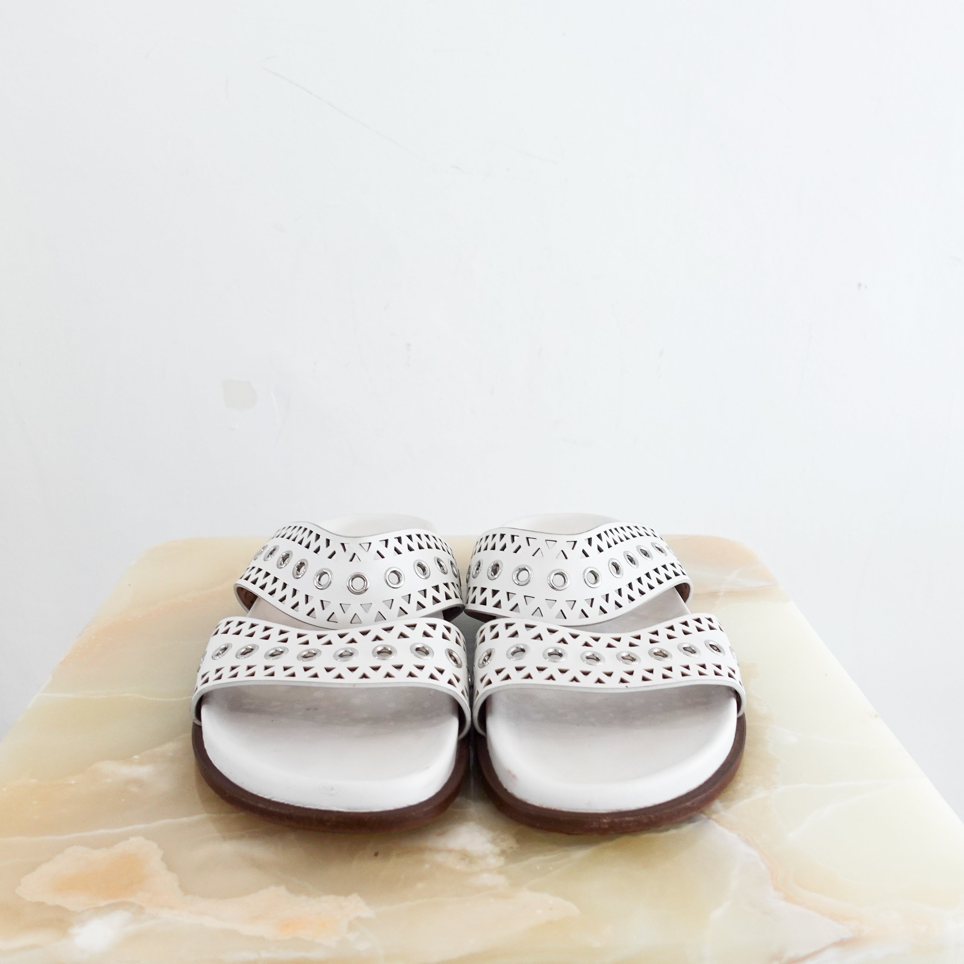Alaia Perforated Sliders in white RRP £750 | Authentic Preloved