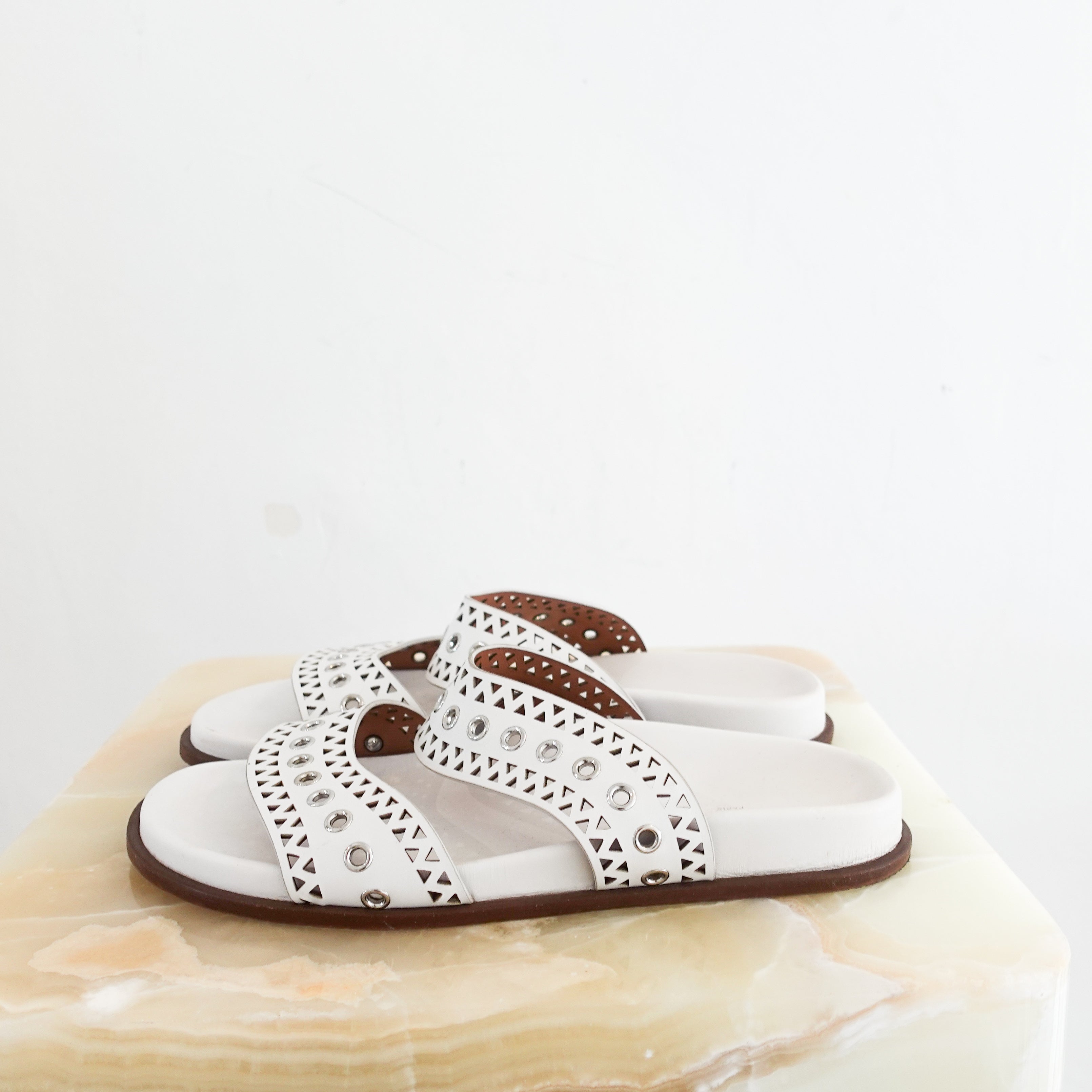 Alaia Perforated Sliders in white RRP £750 | Authentic Preloved