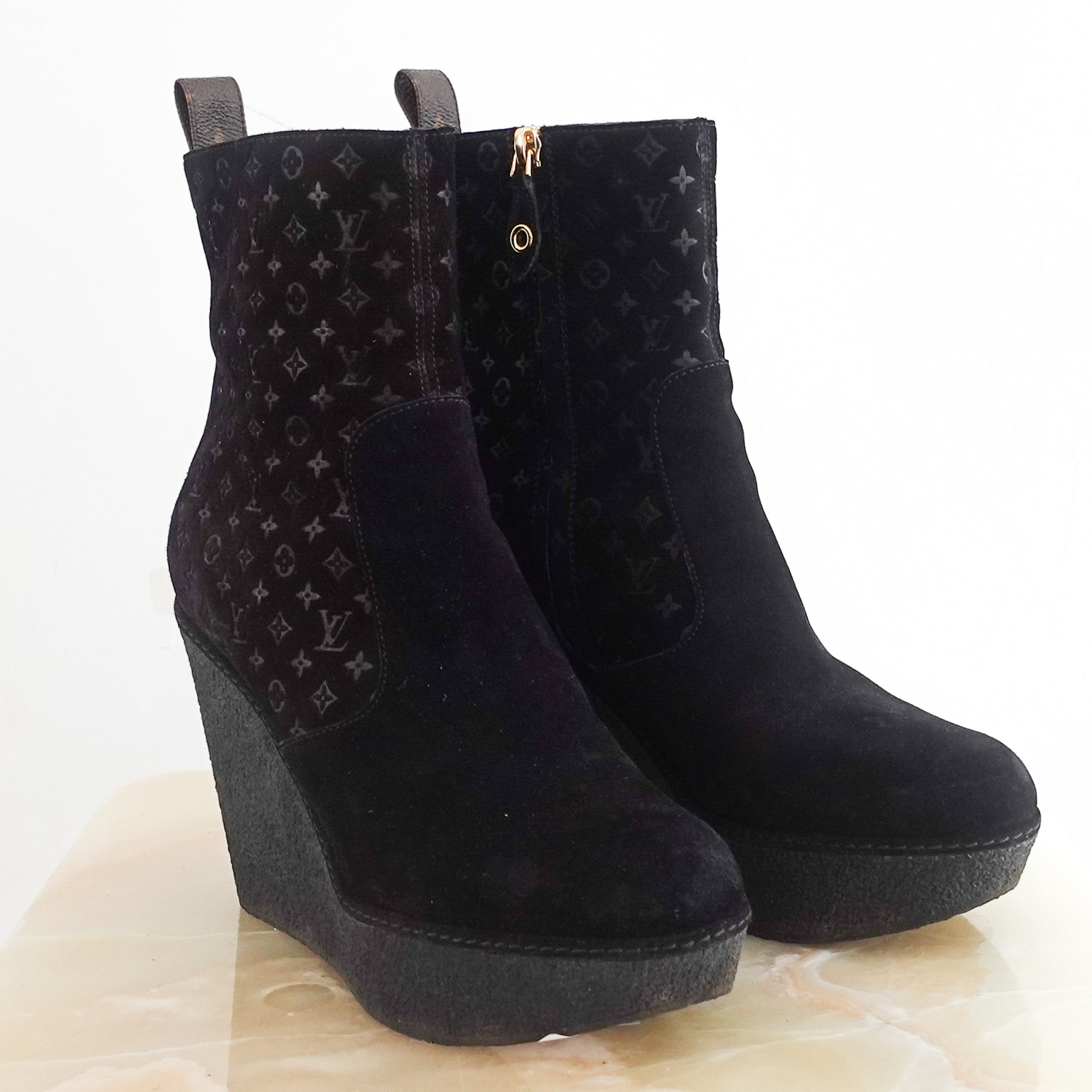 Monogram embossed wedge boots RRP £325