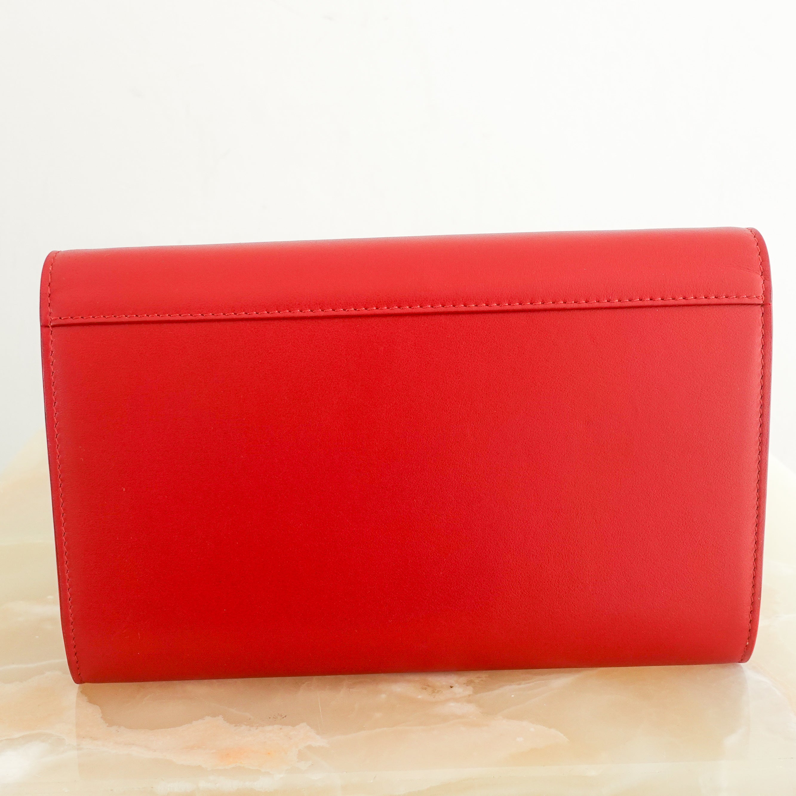 Red leather clutch RRP £620