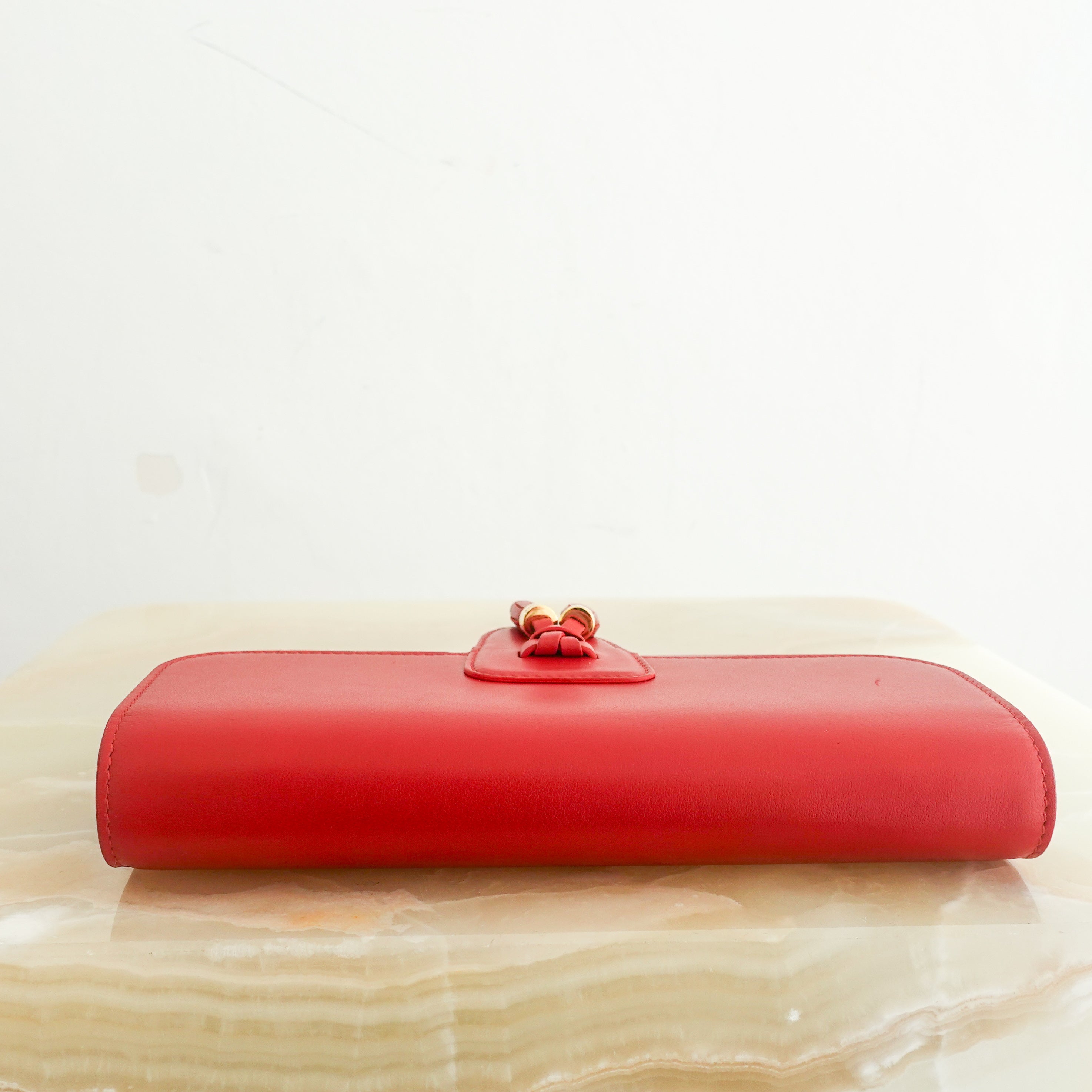 Red leather clutch RRP £620