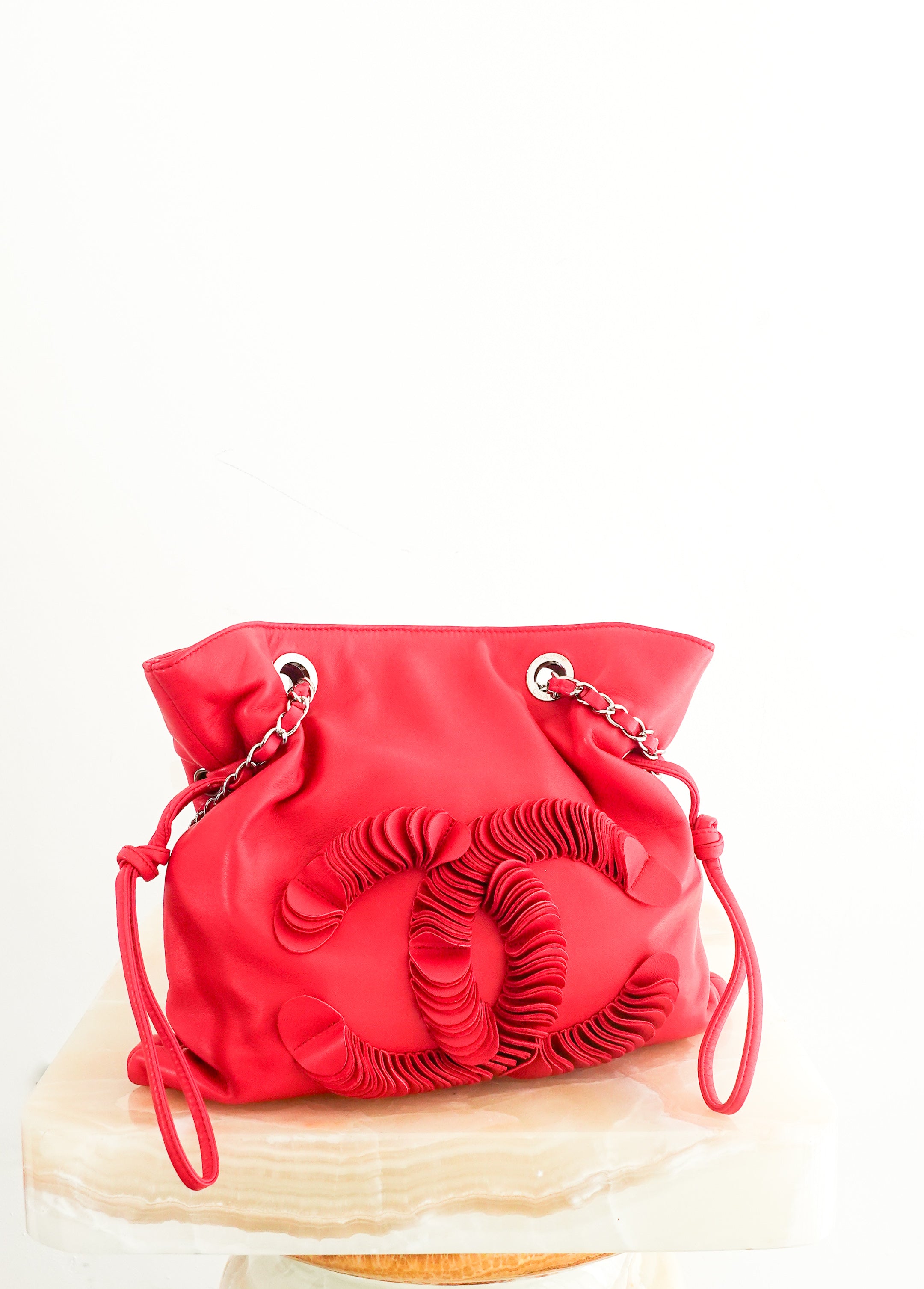 red leather disc bon bon bag