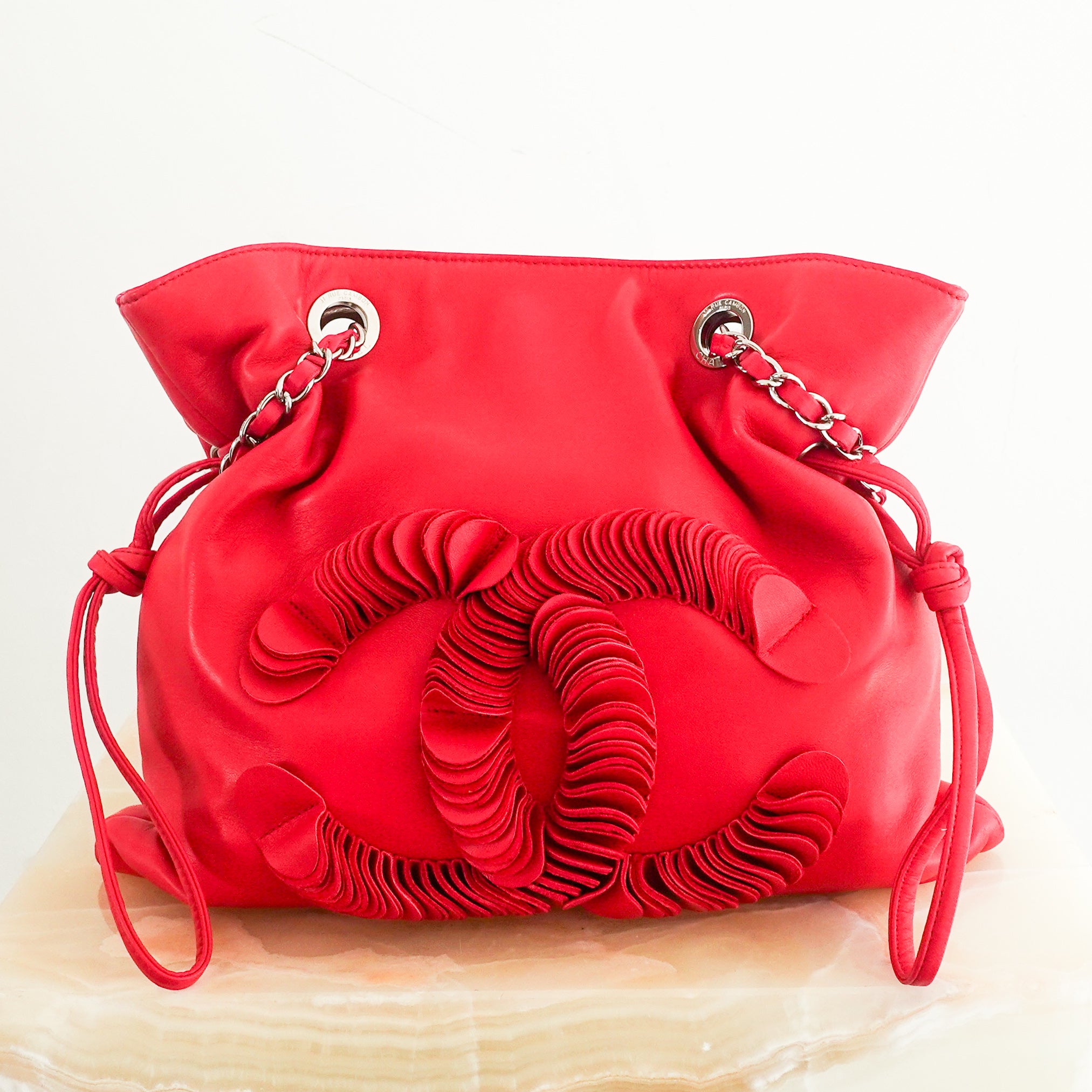 red leather disc bon bon bag