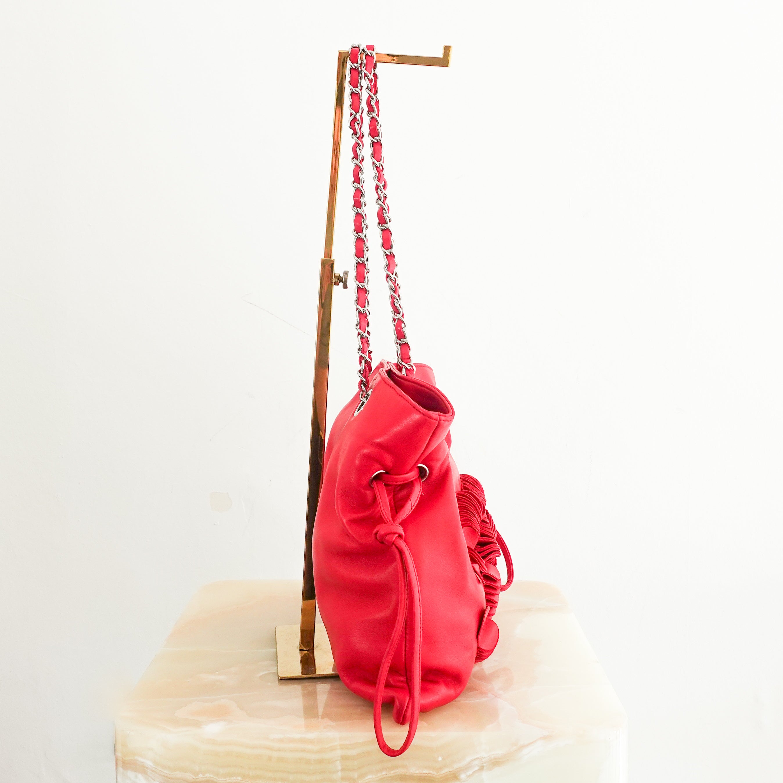 red leather disc bon bon bag