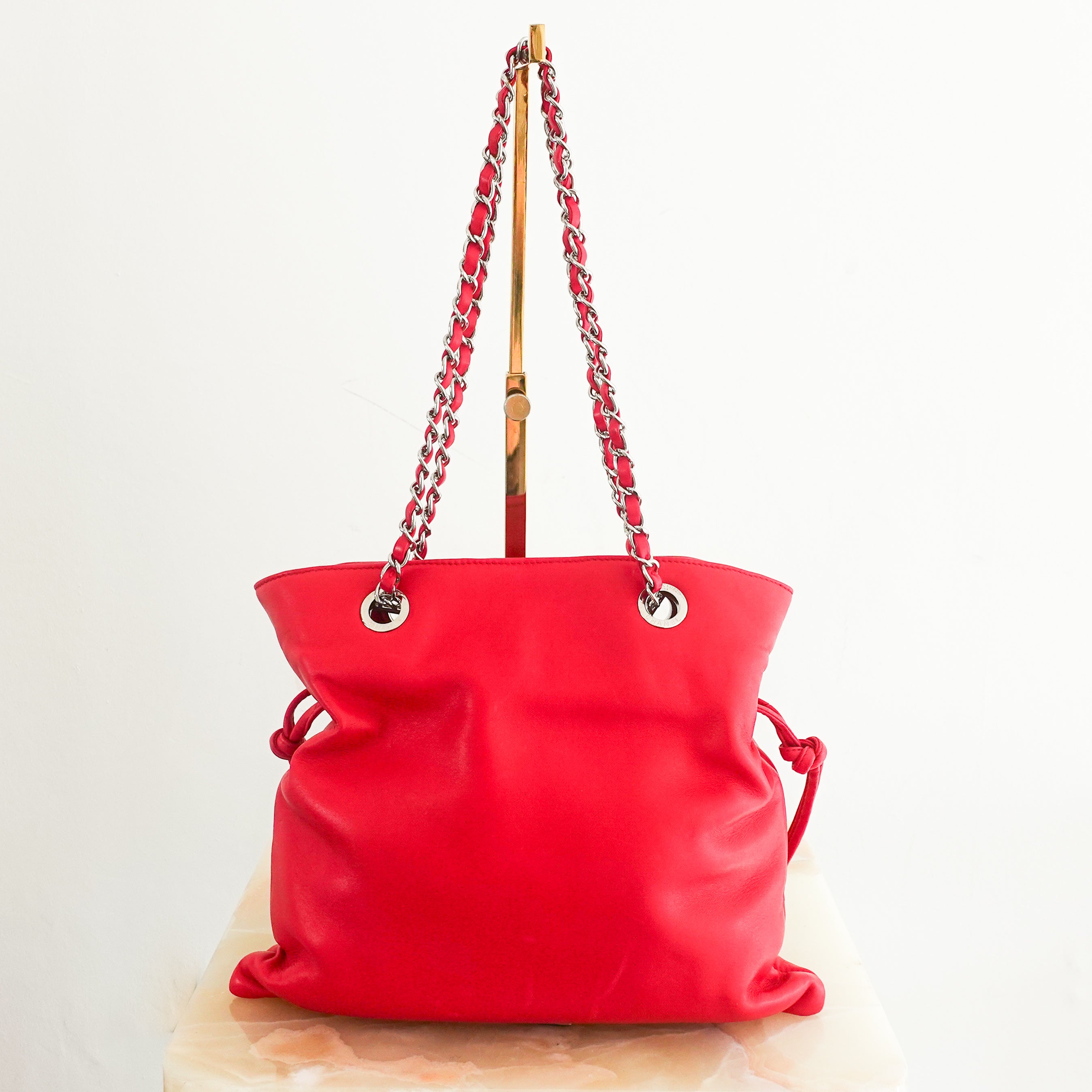 red leather disc bon bon bag