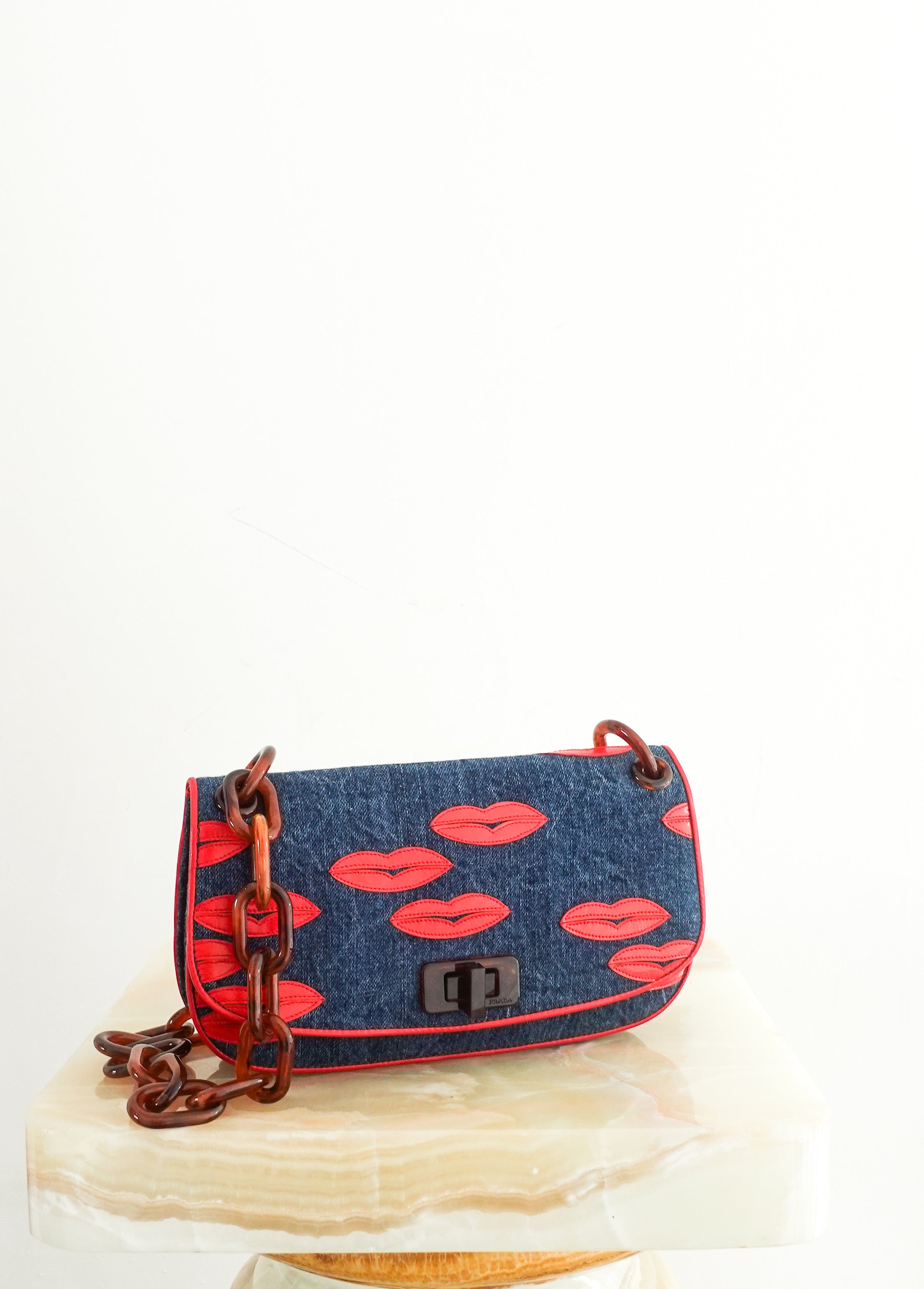 denim lip motif clutch