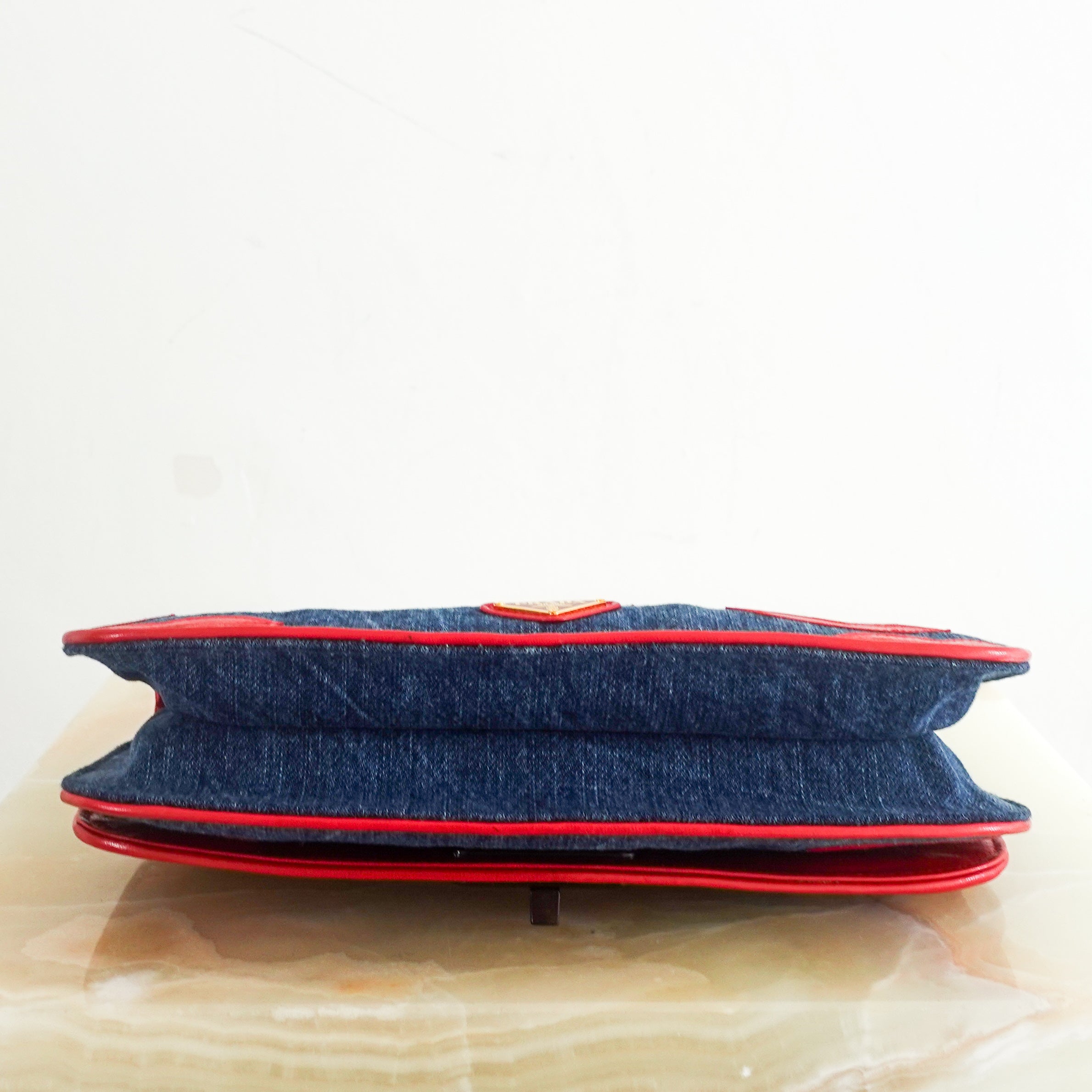 denim lip motif clutch