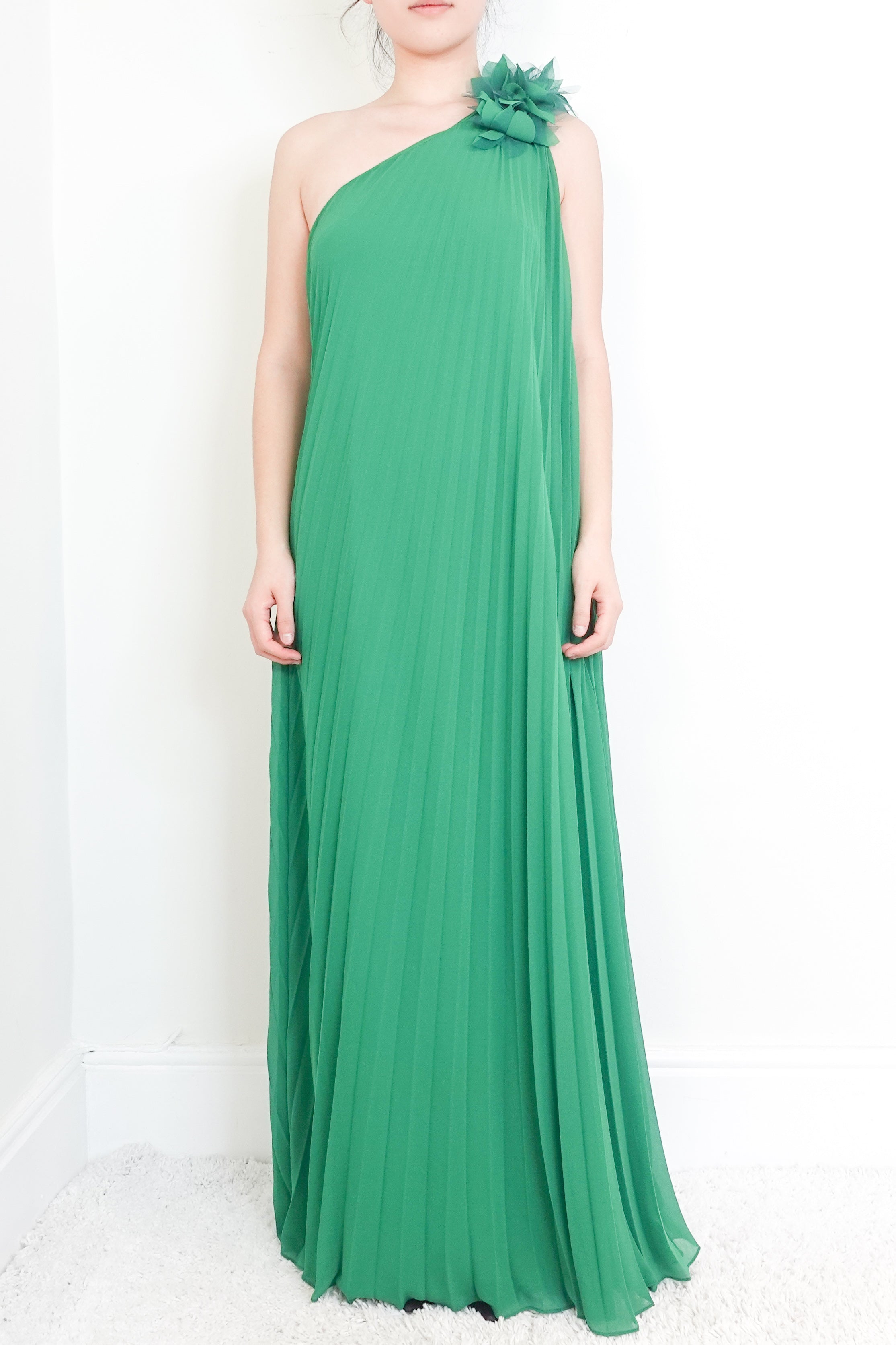 Green one-shoulder pleated gown