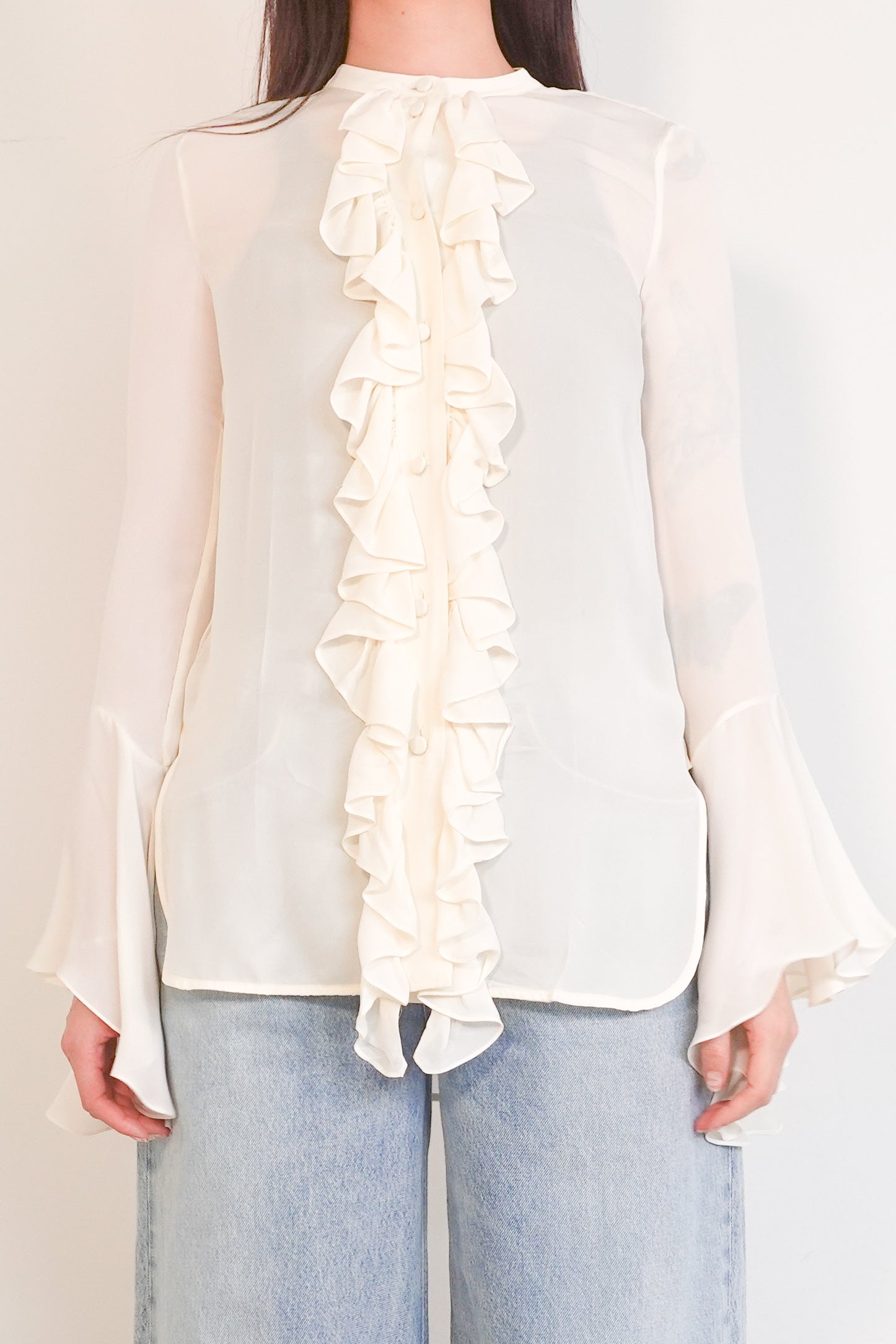 Cream ruffled blouse