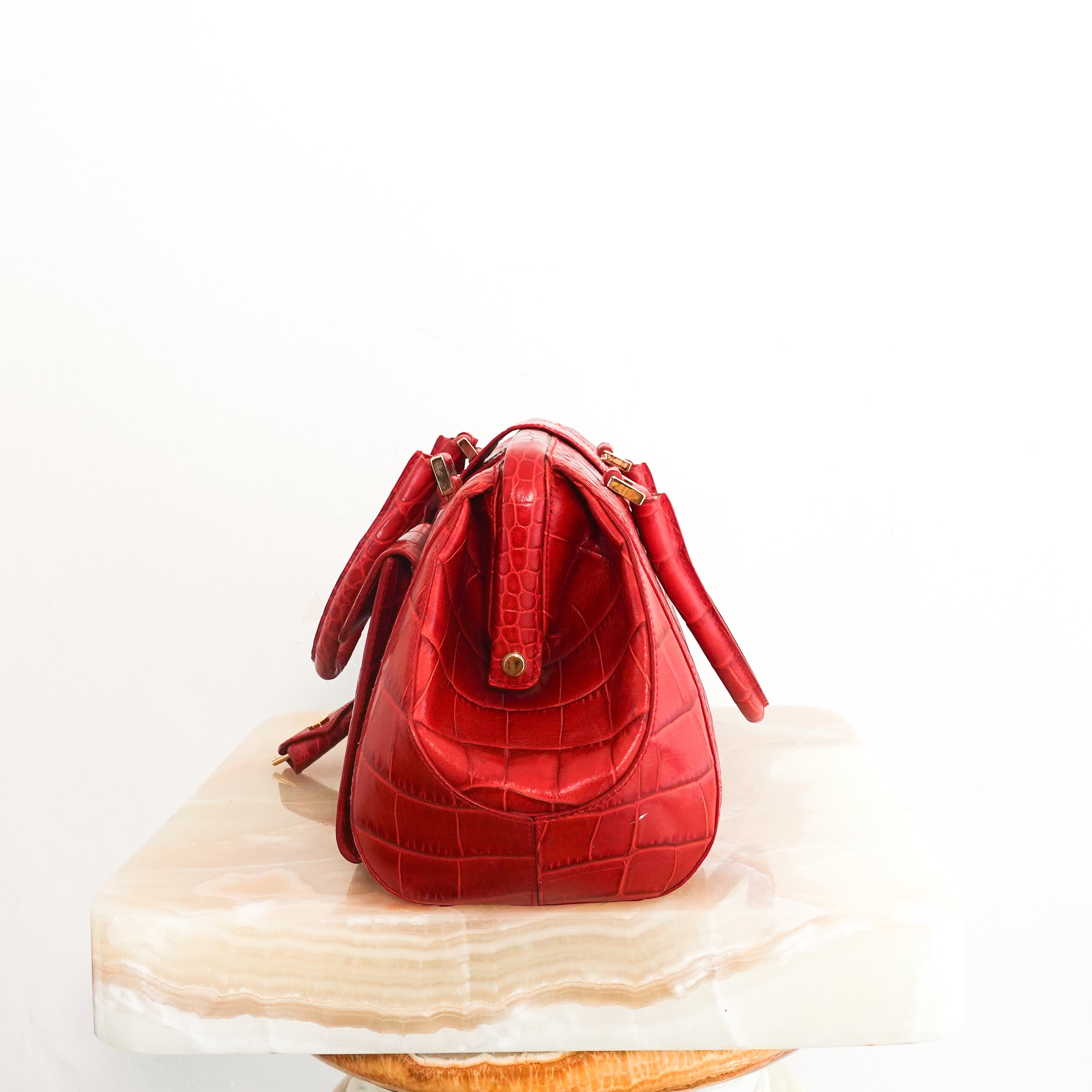 Red embossed handbag