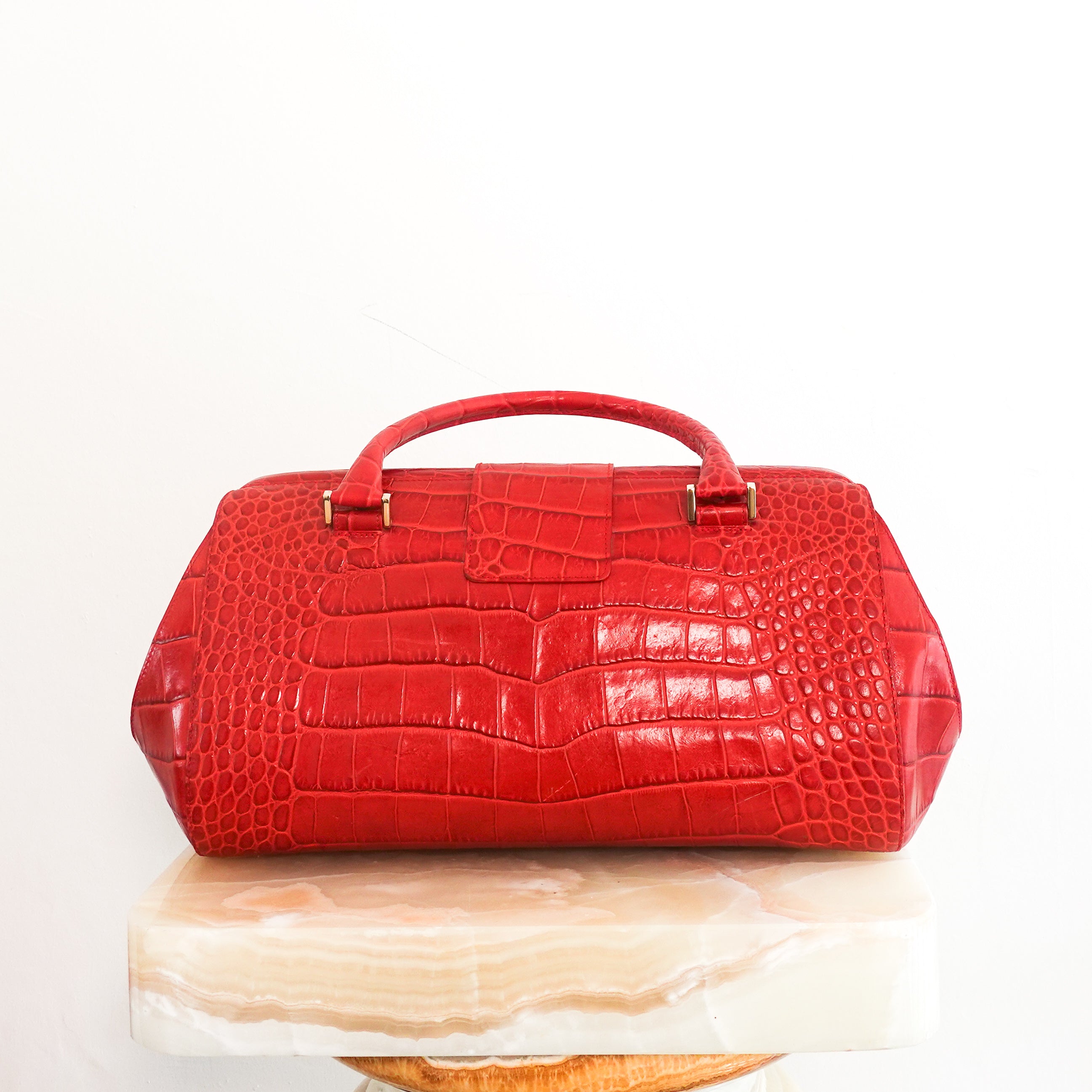 Red embossed handbag