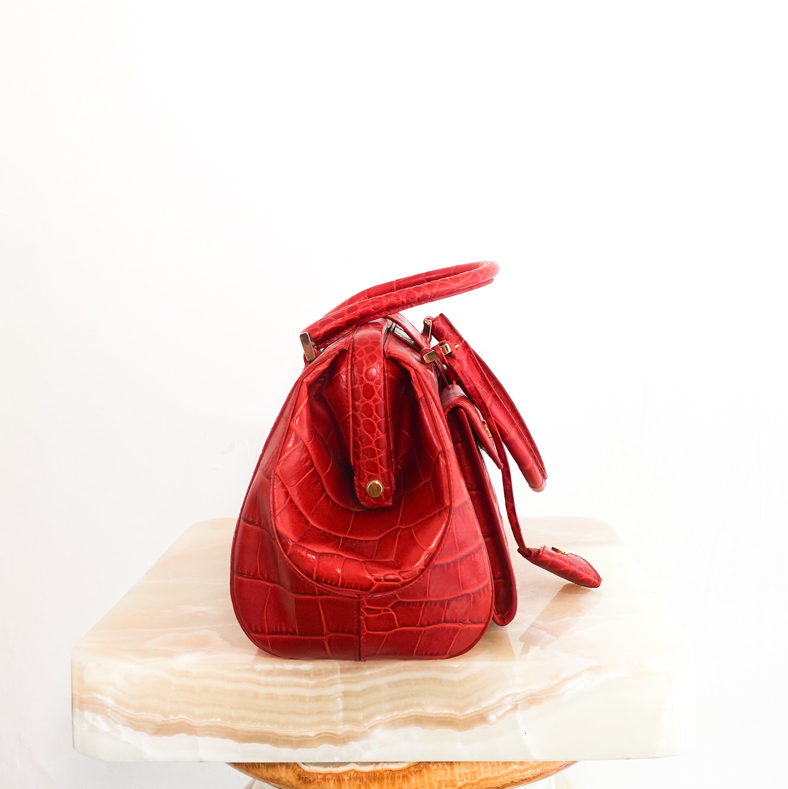 Red embossed handbag