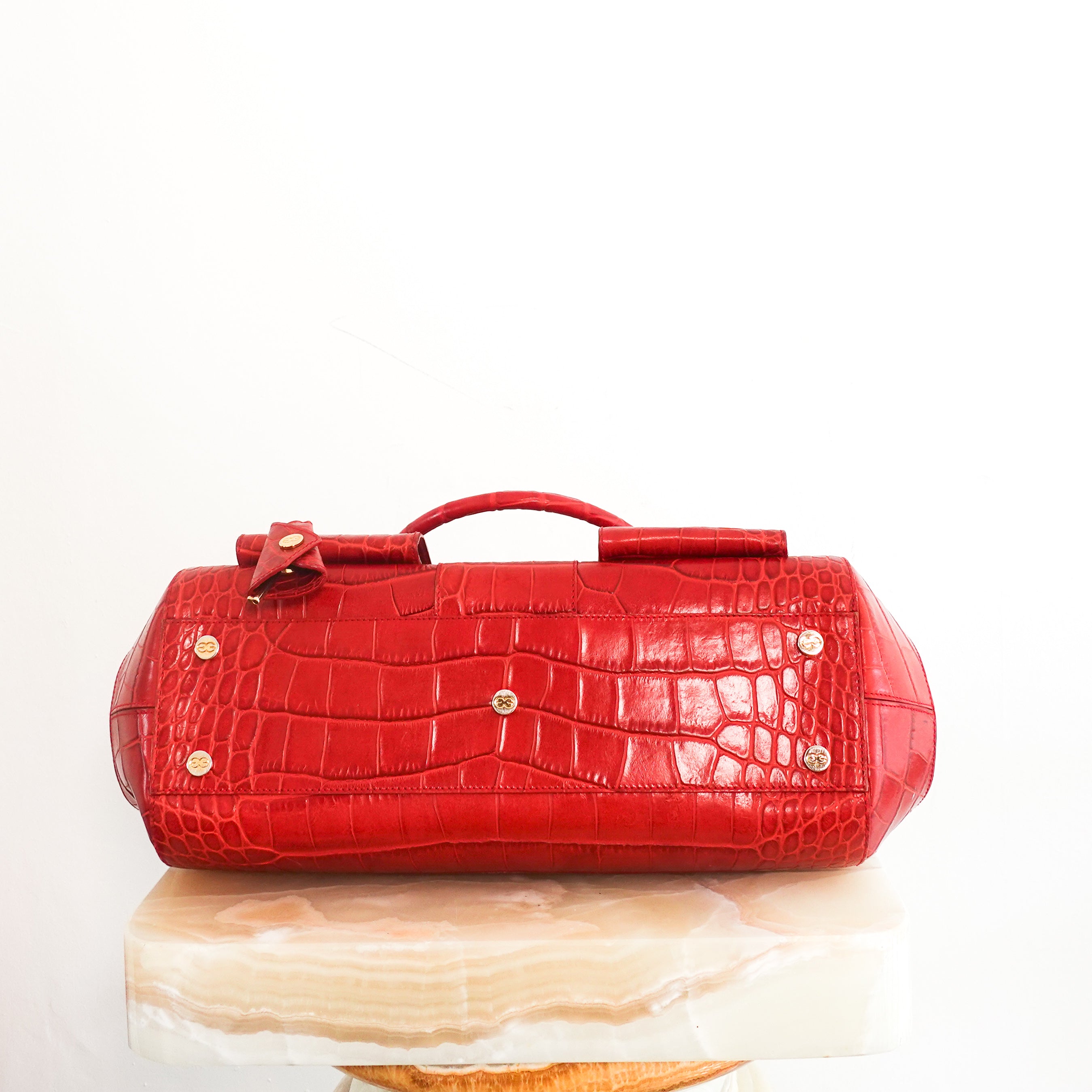 Red embossed handbag