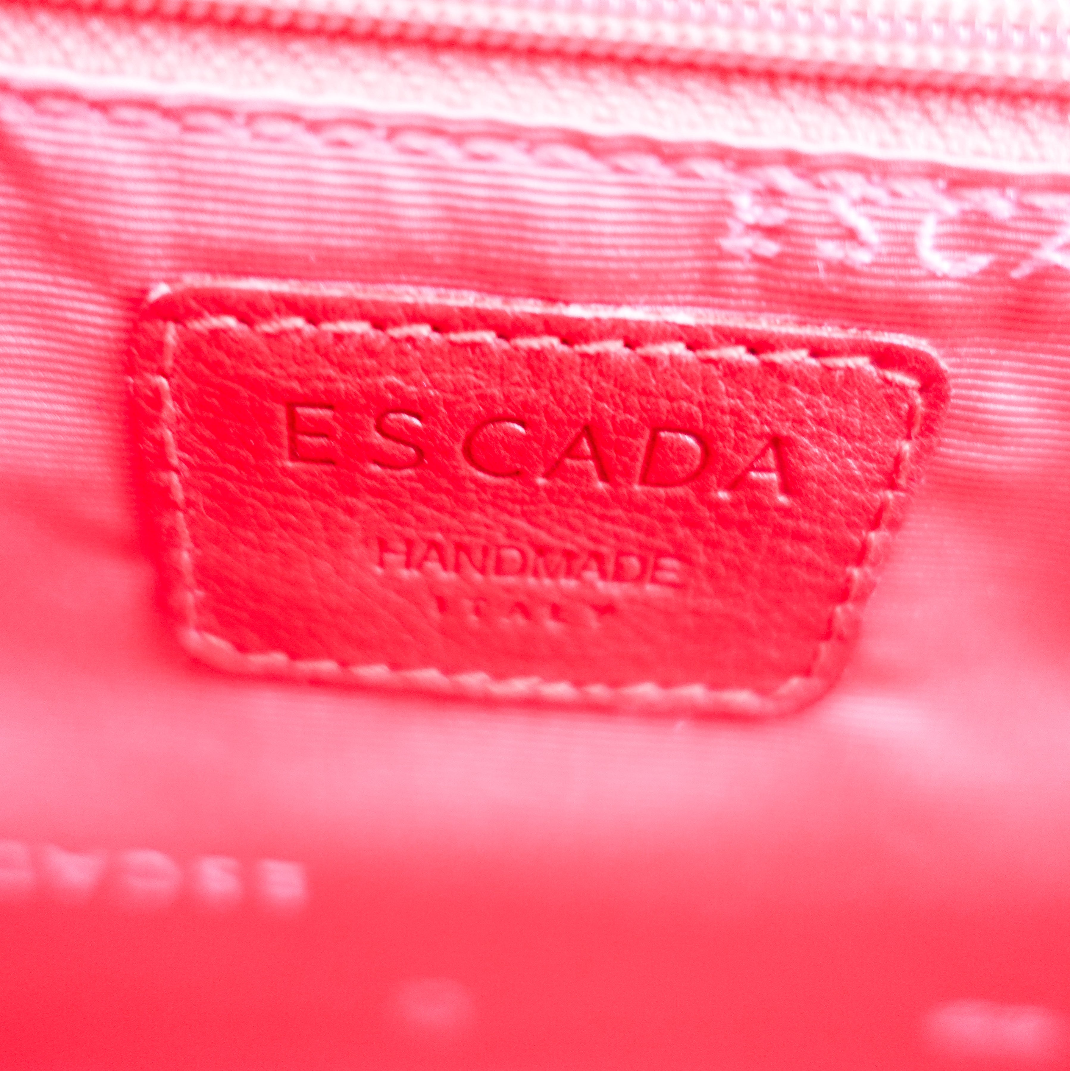 Red embossed handbag