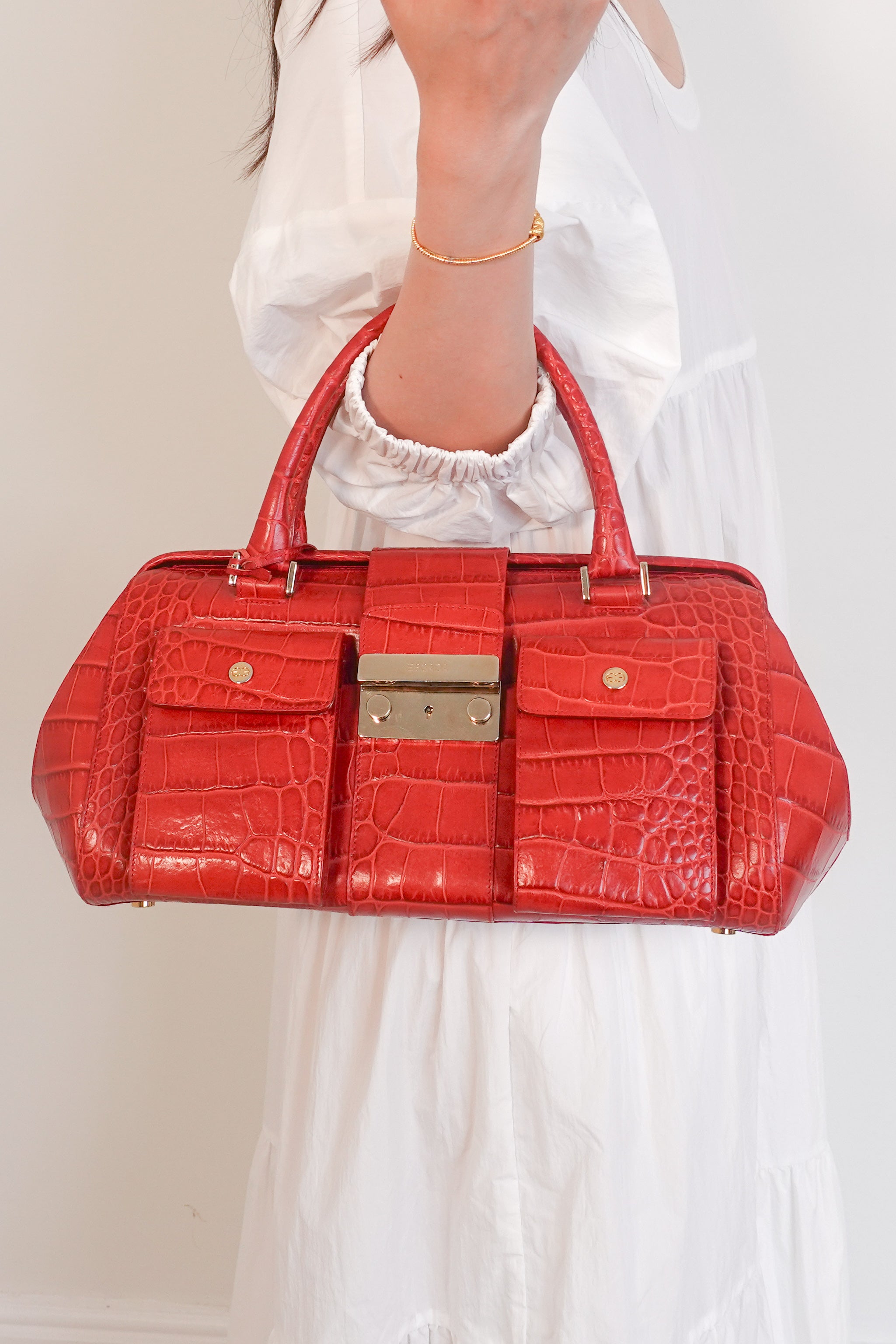 Red embossed handbag