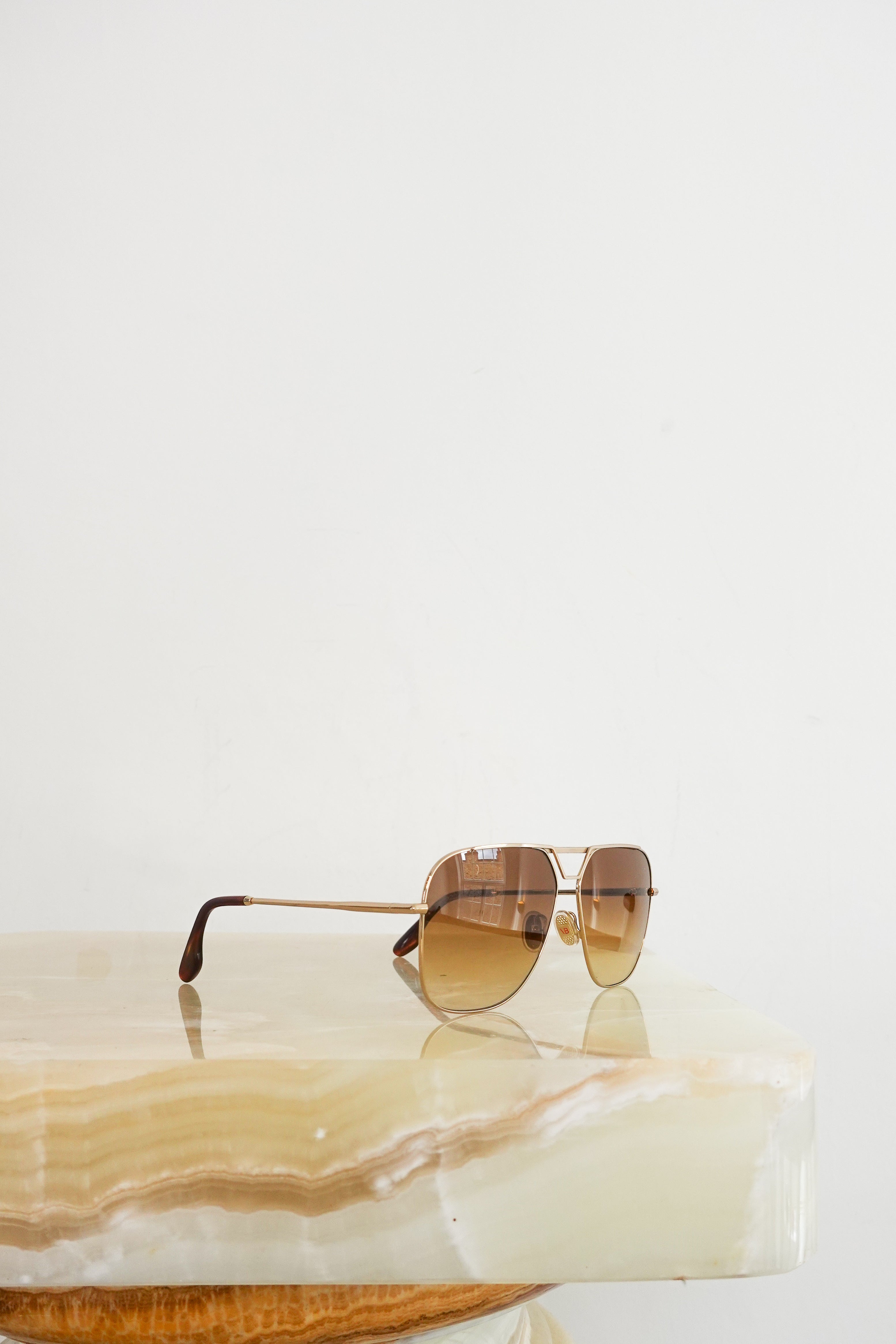 Brown and gold aviator sunglasses