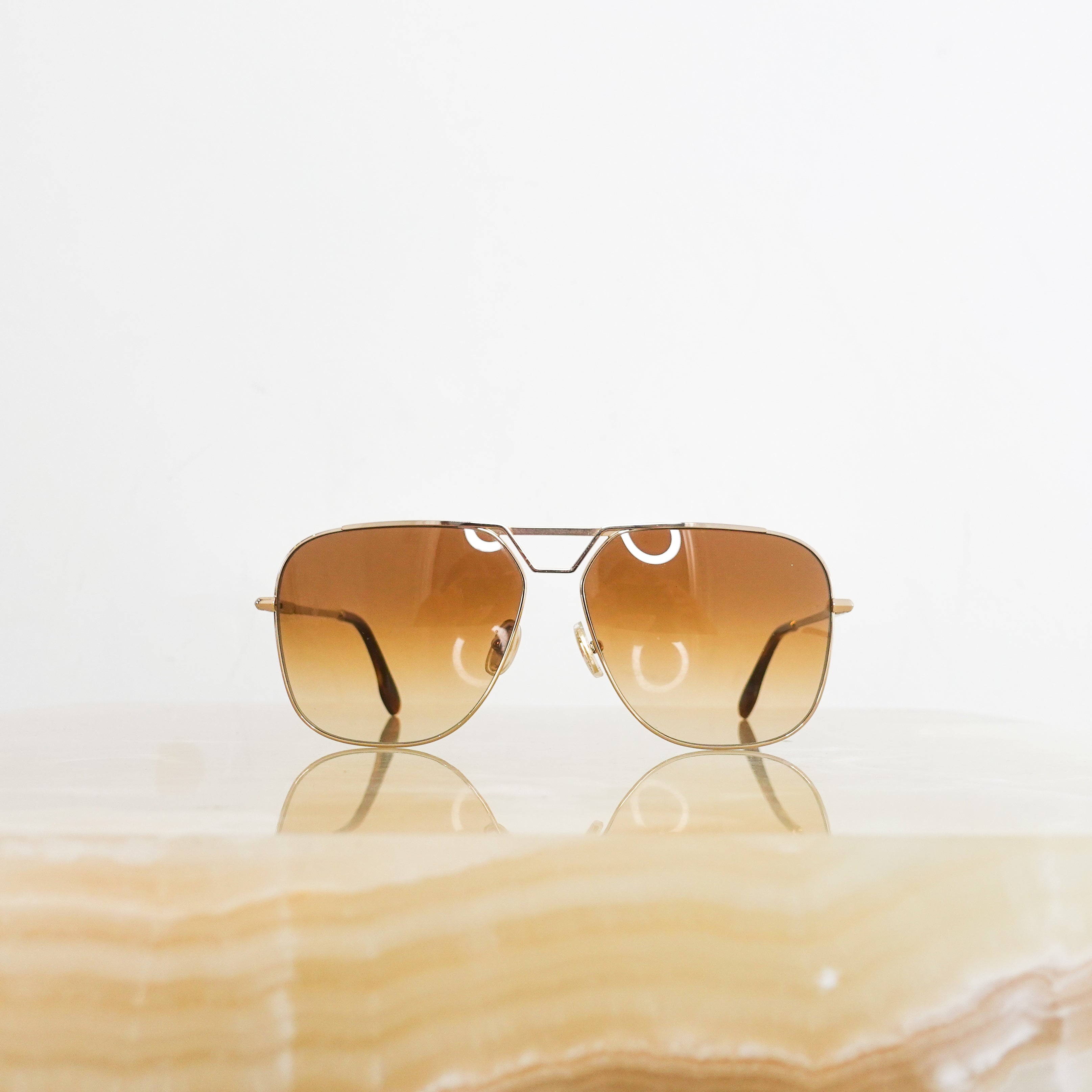 Brown and gold aviator sunglasses