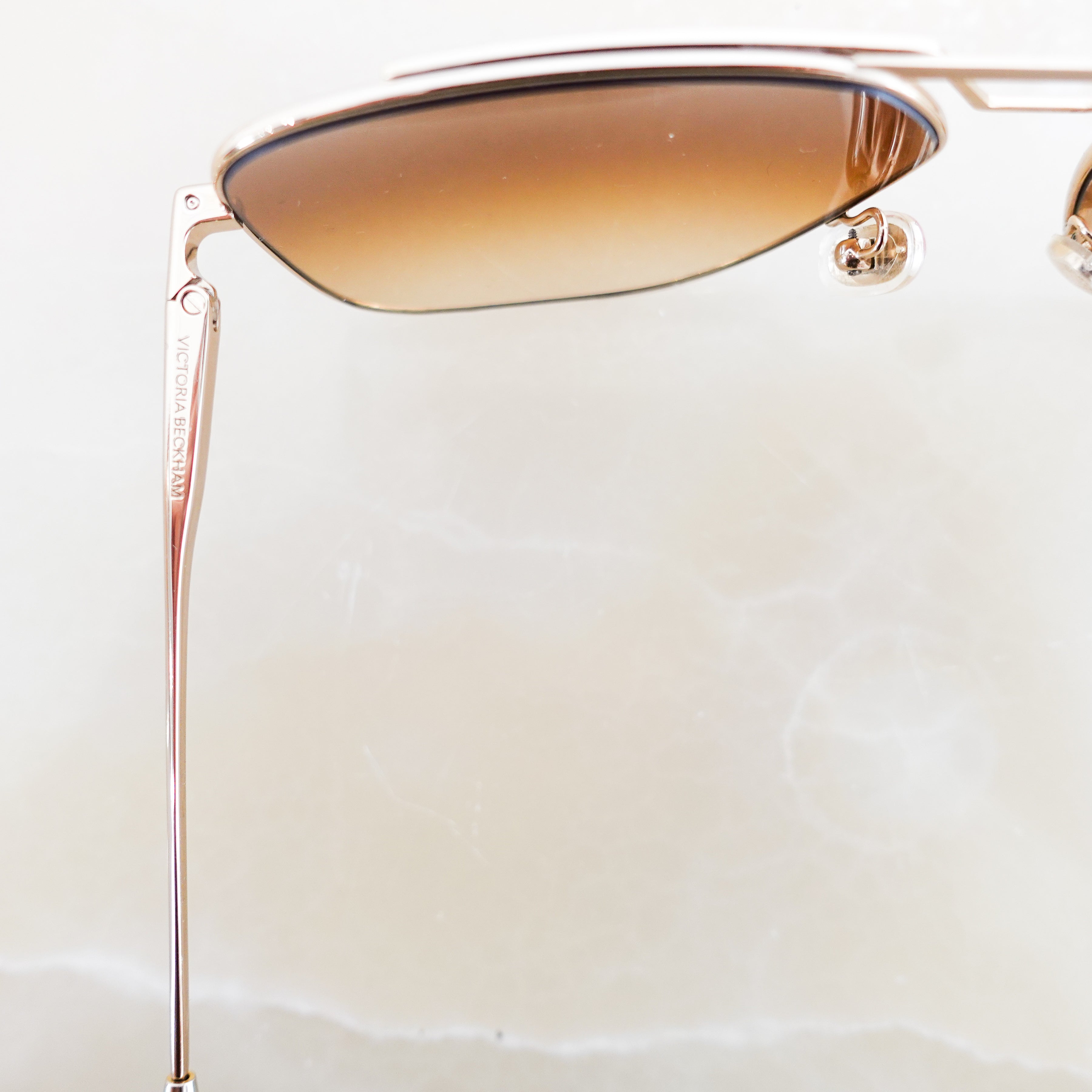 Brown and gold aviator sunglasses