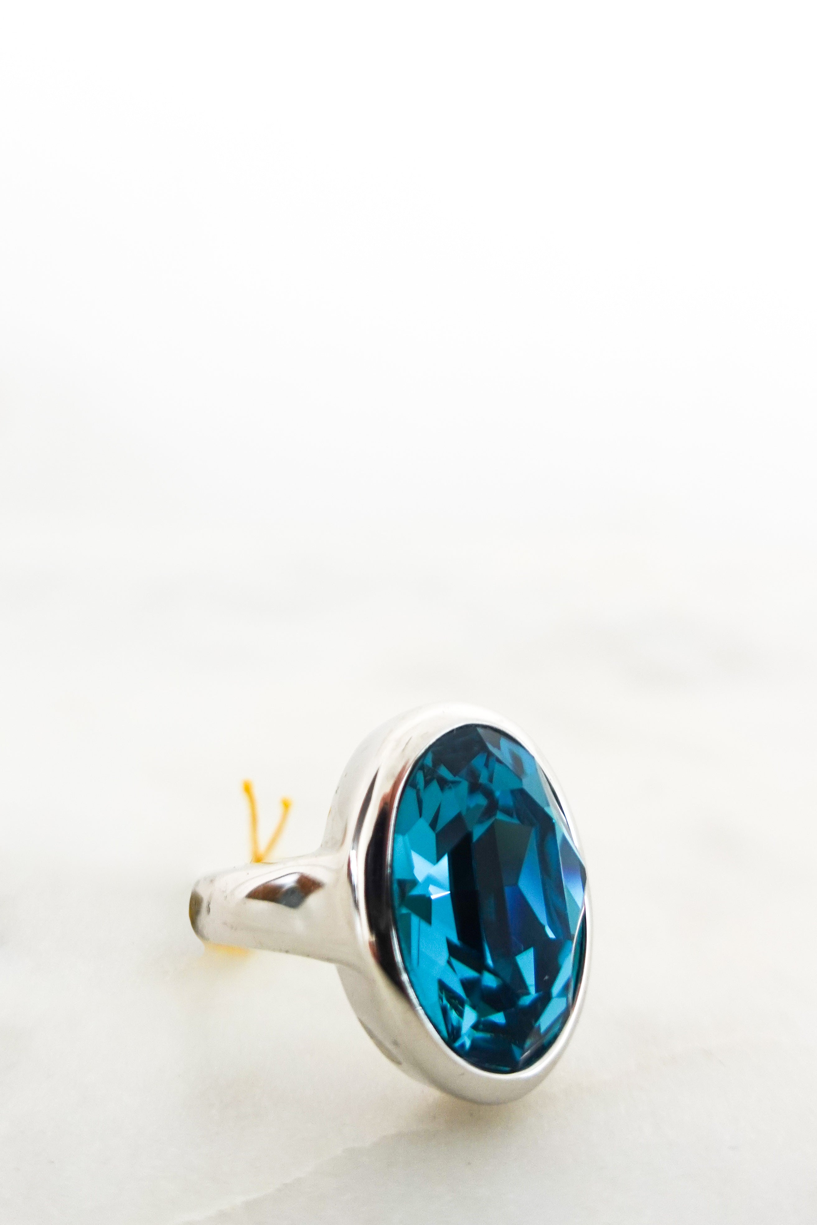 Rhodium plated Teal oval ring