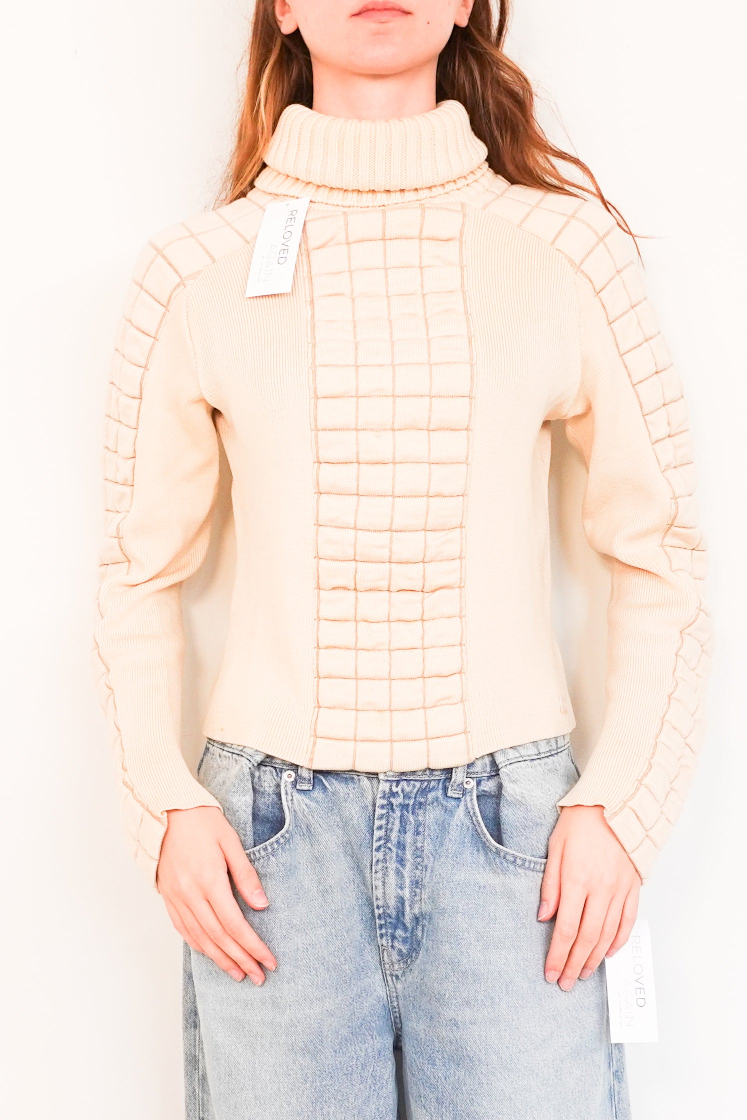 Beige turtleneck with quilting