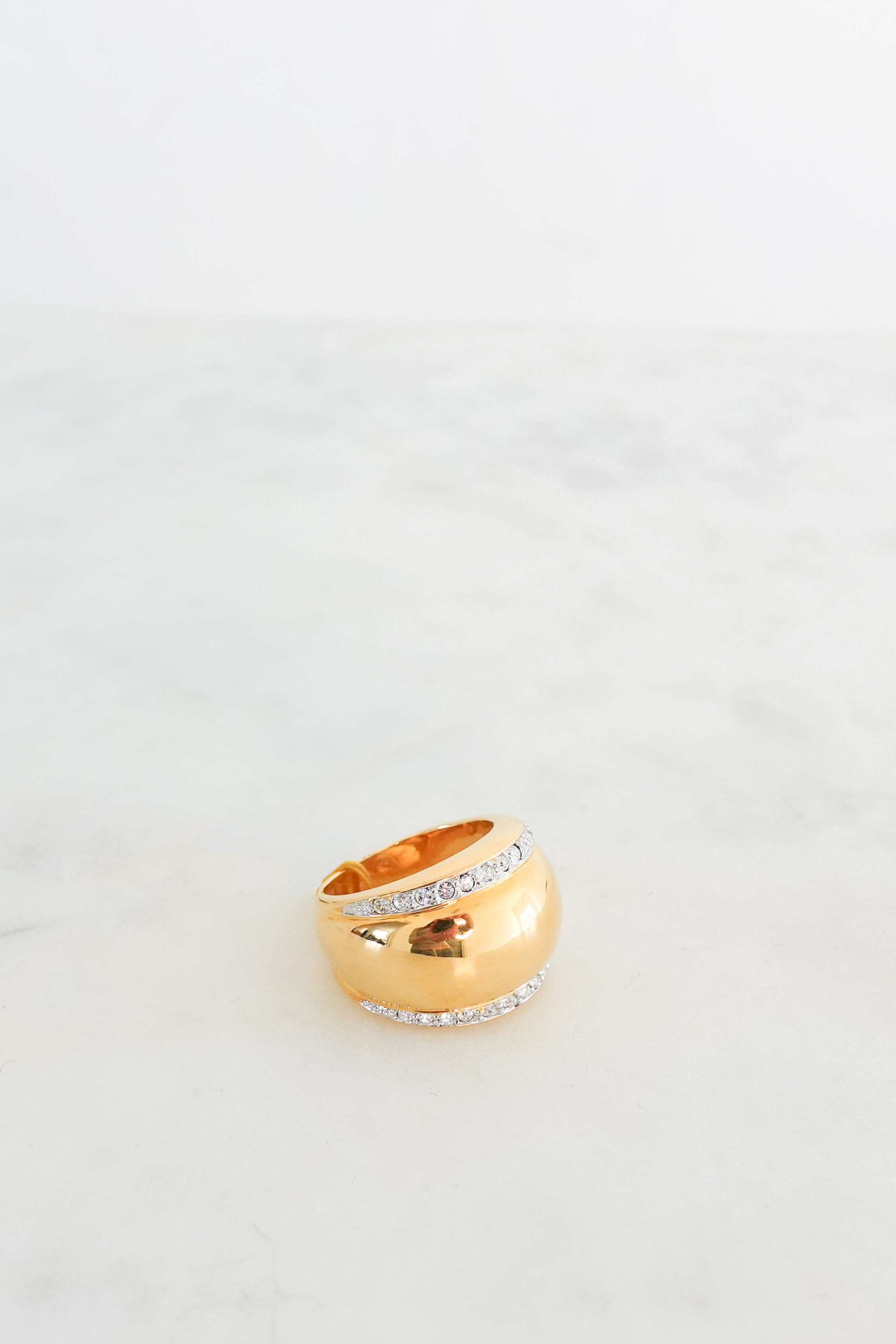 Gold plated Tramline ring with colourless crystals