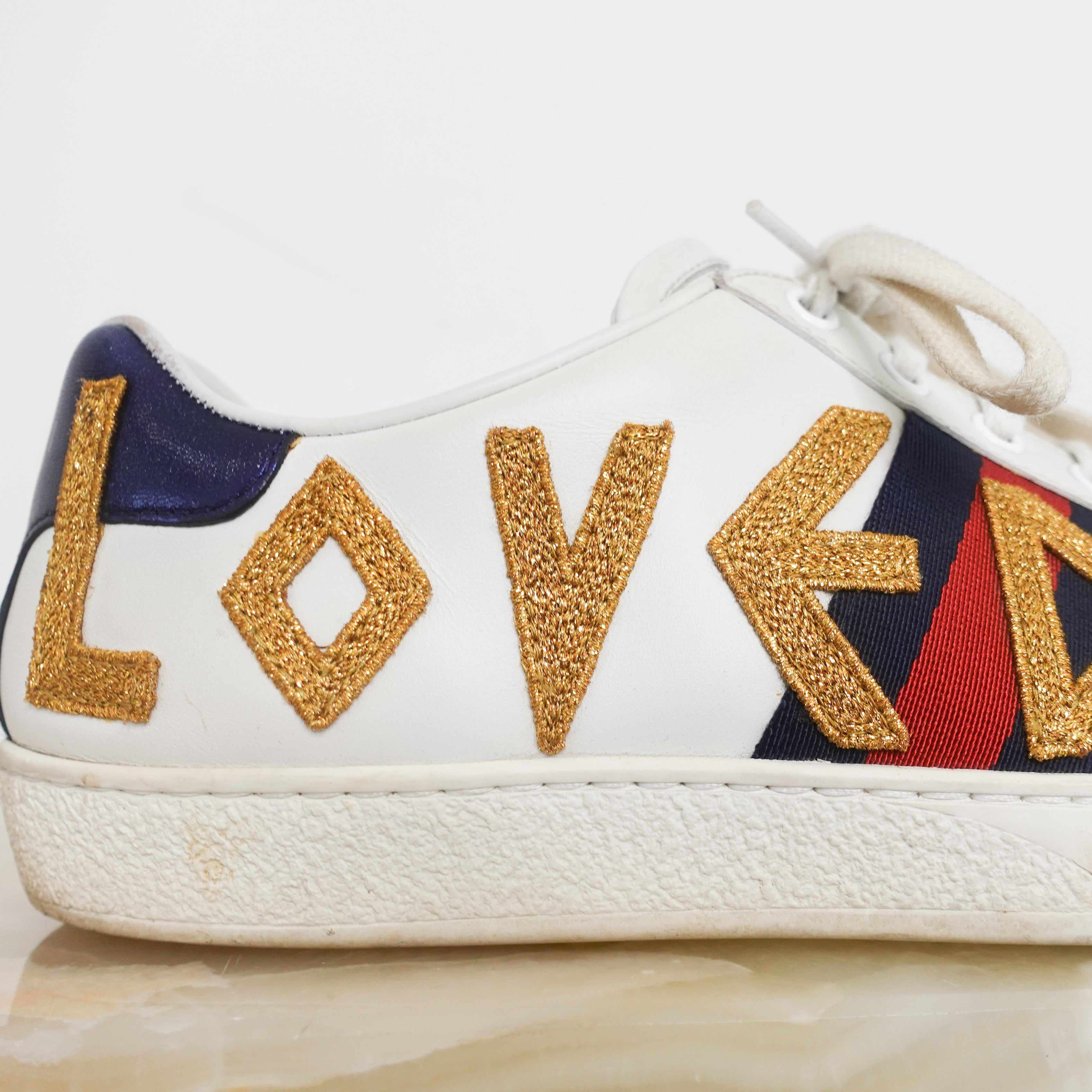 Aced ‘Loved’ leather trainers RRP £625