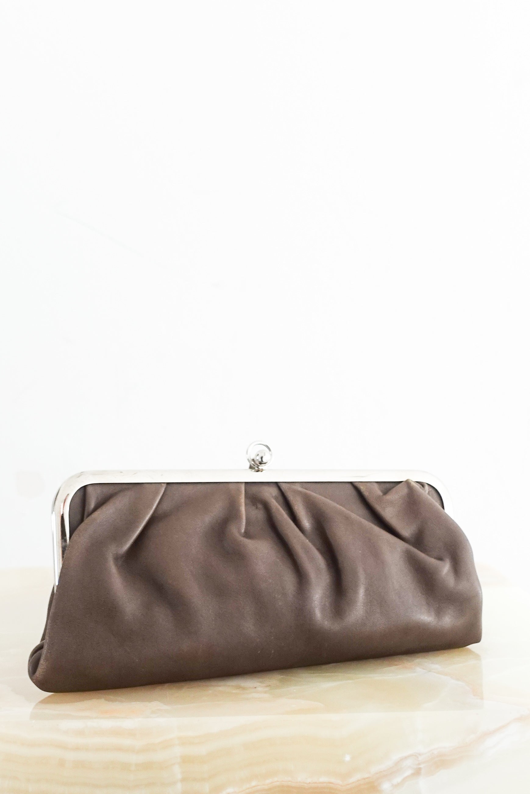 Brown snap closure clutch RRP £225