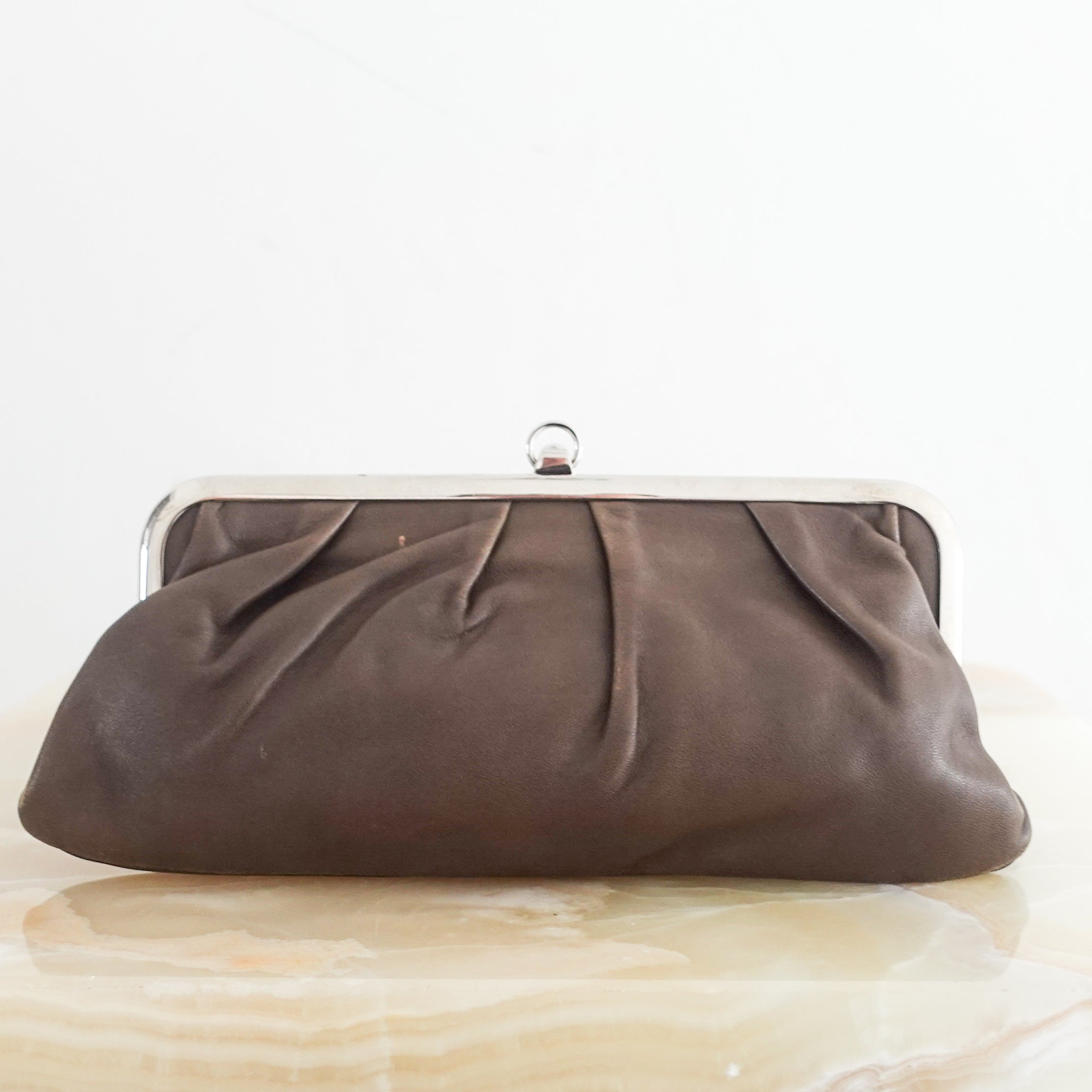 Brown snap closure clutch RRP £225