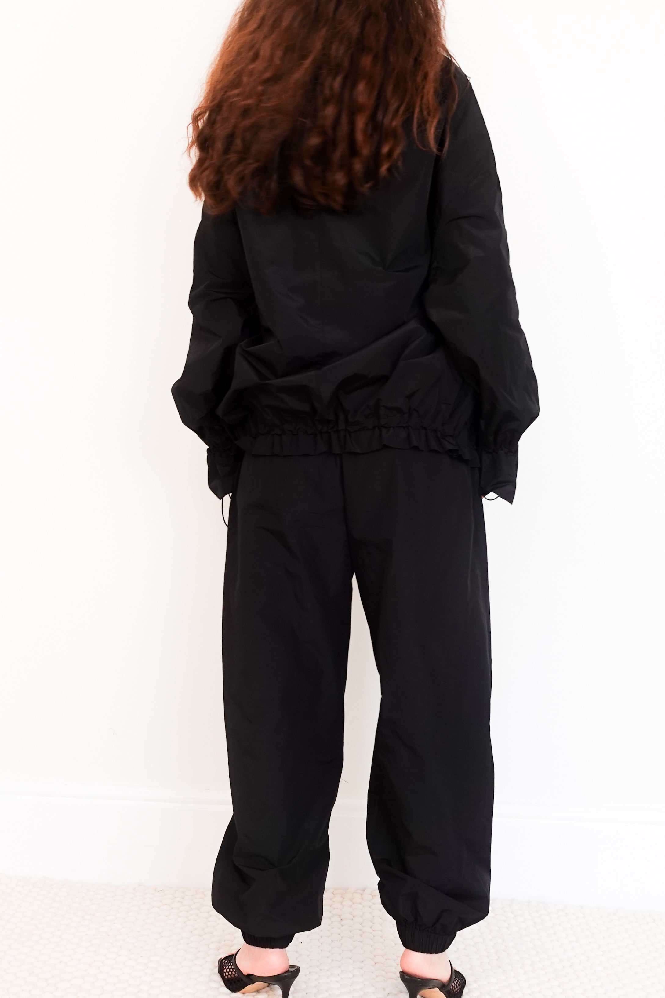 Black costume supportive tracksuit RRP £350