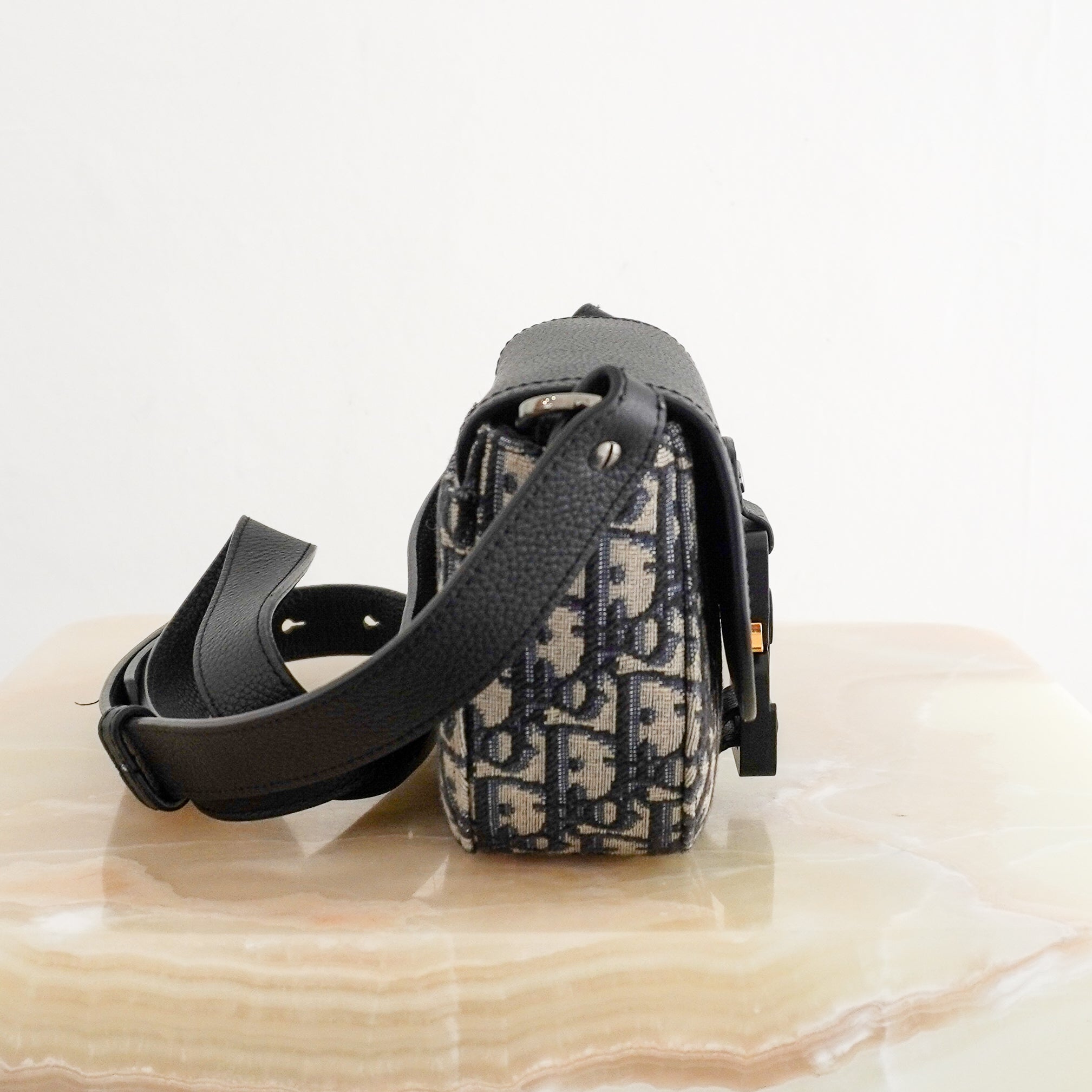 Dior Mini Saddle Messenger Bag with Flap in Beige and Black Dior Oblique Jacquard side photo chelsea london