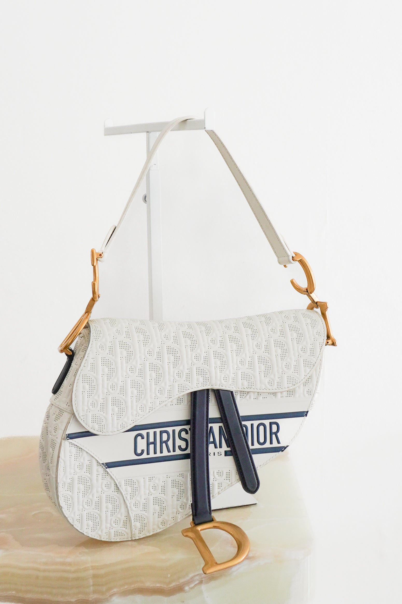 Dior White Perforated Oblique Saddle Bag with Strap front photo chelsea london