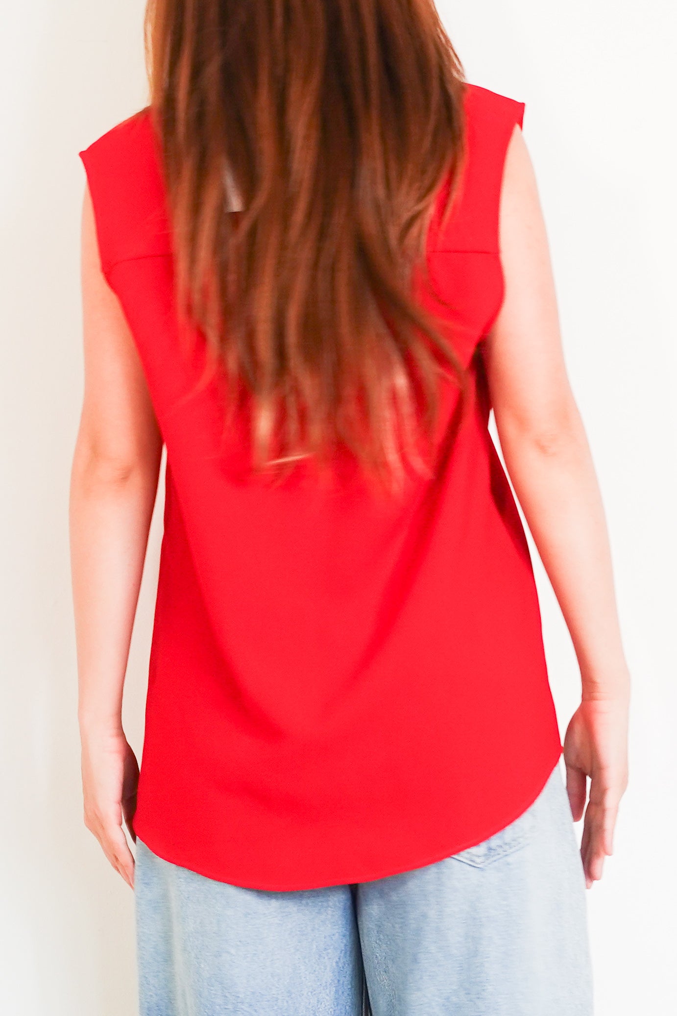 Red sleeveless top with crystal mesh appliqué